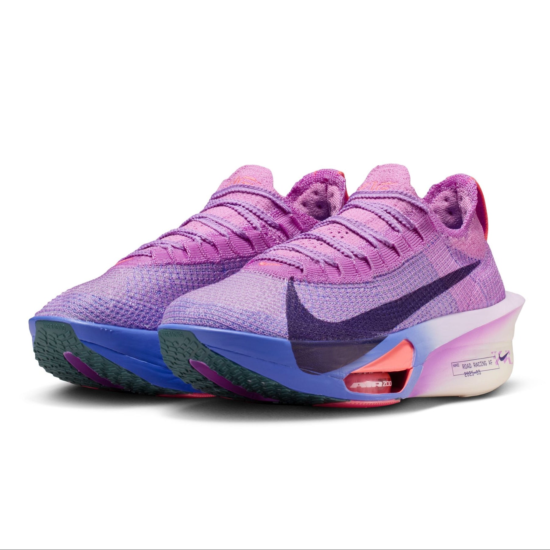 Pair of pink and purple Nike sneakers on a white background
