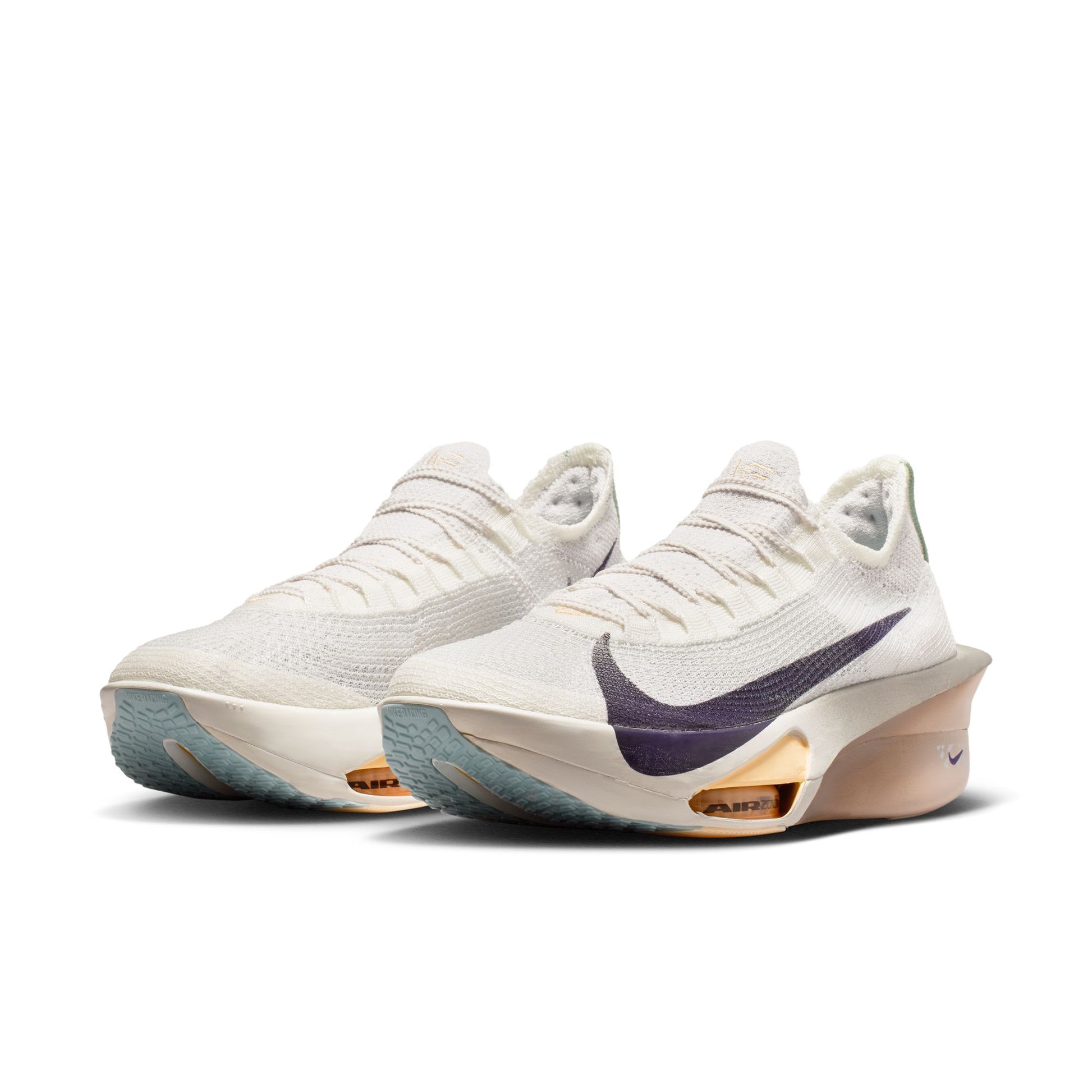 White sneakers with a purple swoosh logo on a white background