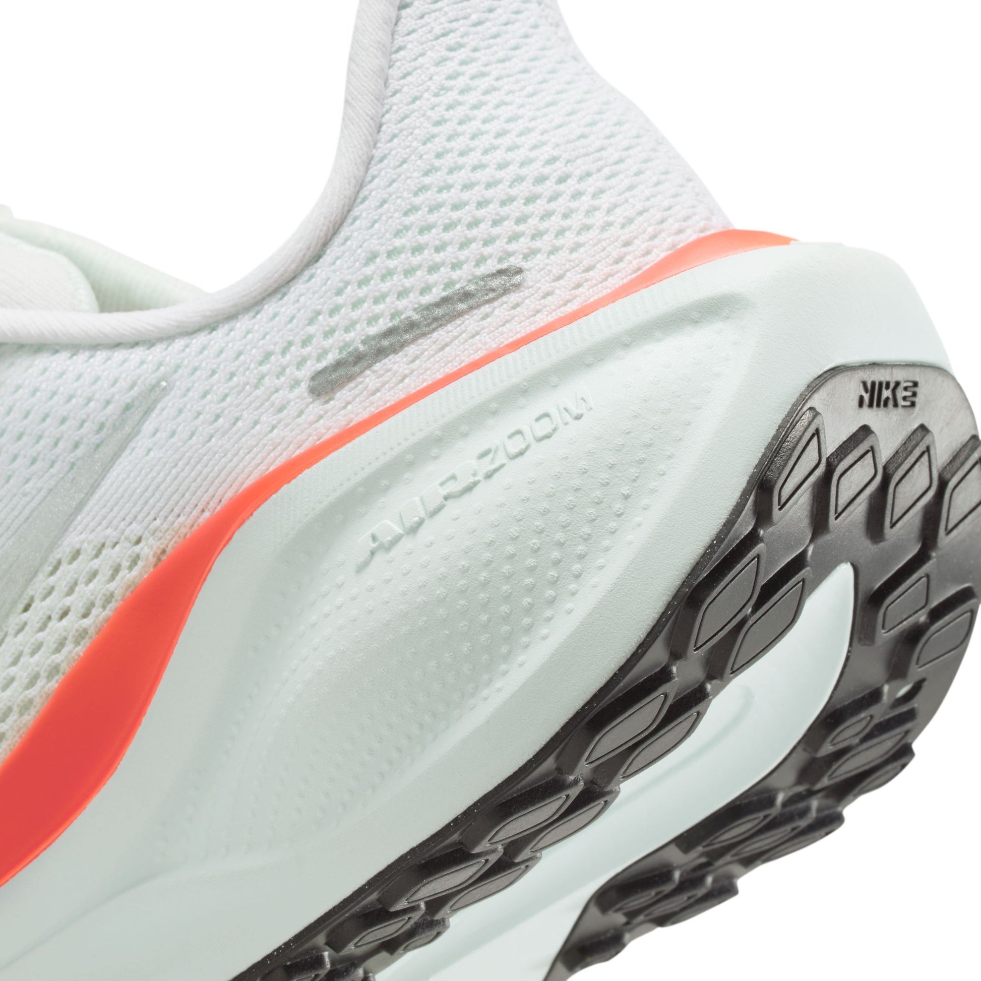 Close-up of a running shoe with 'Air Zoom' and 'Nike' branding on a white background
