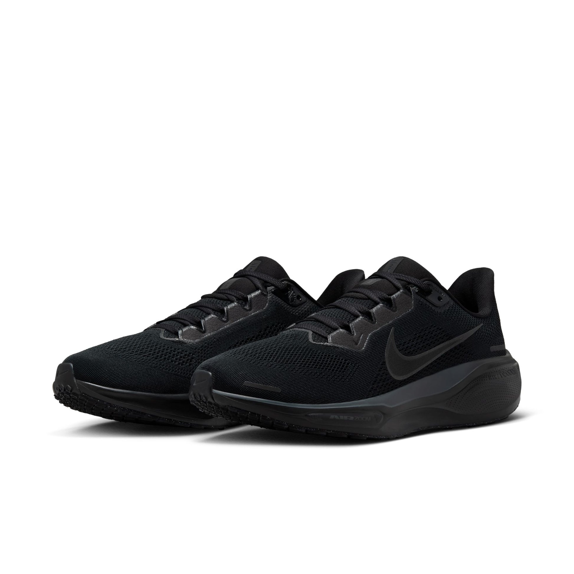 Black athletic shoes with Nike logo on a white background