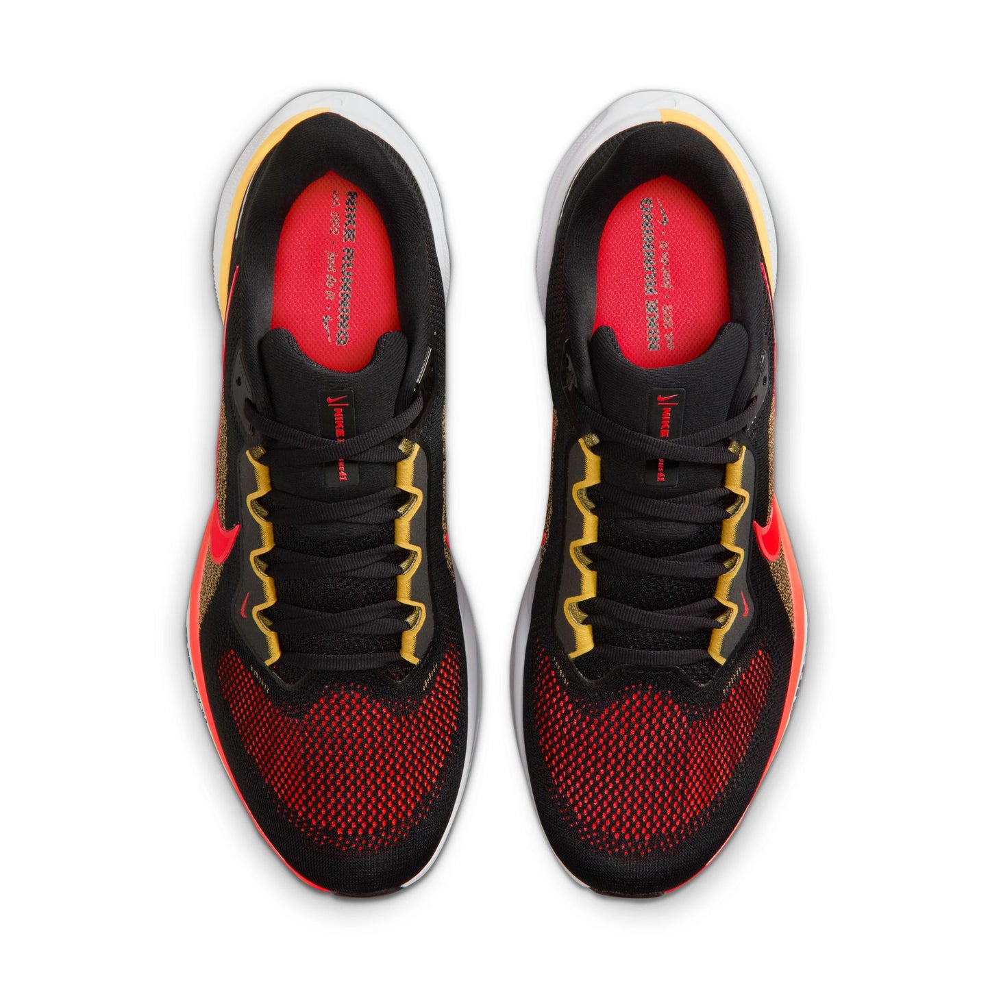 Black and red athletic shoes with yellow accents on a white background