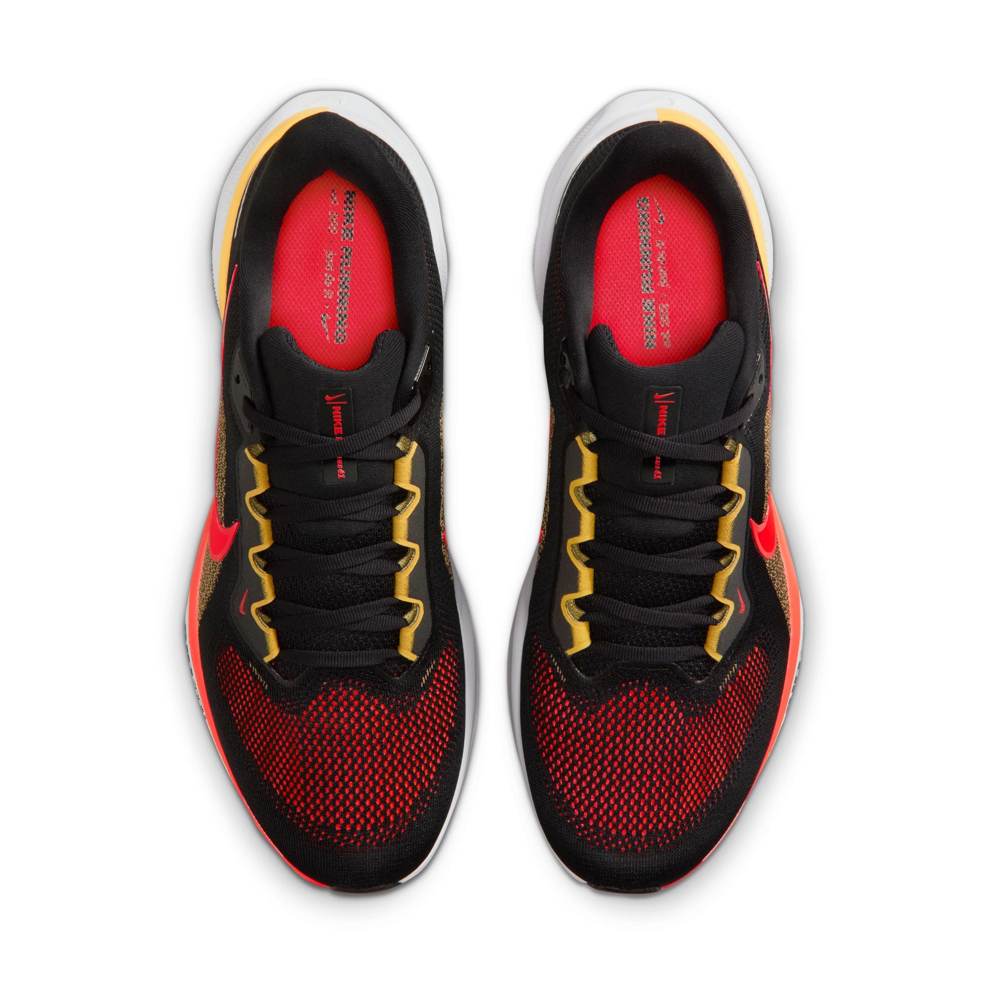 Black and red athletic shoes with yellow accents on a white background
