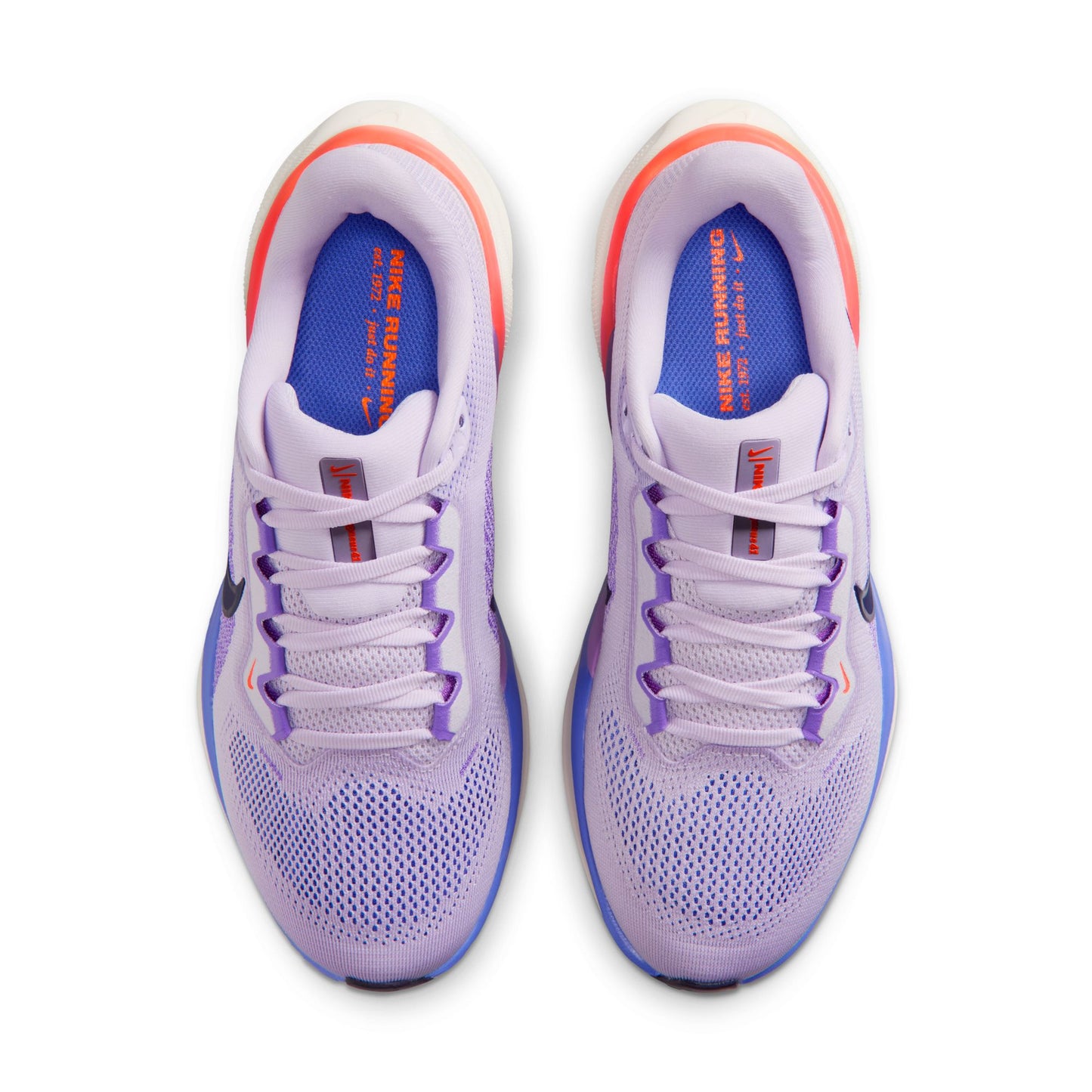Purple running shoes with white soles on a white background