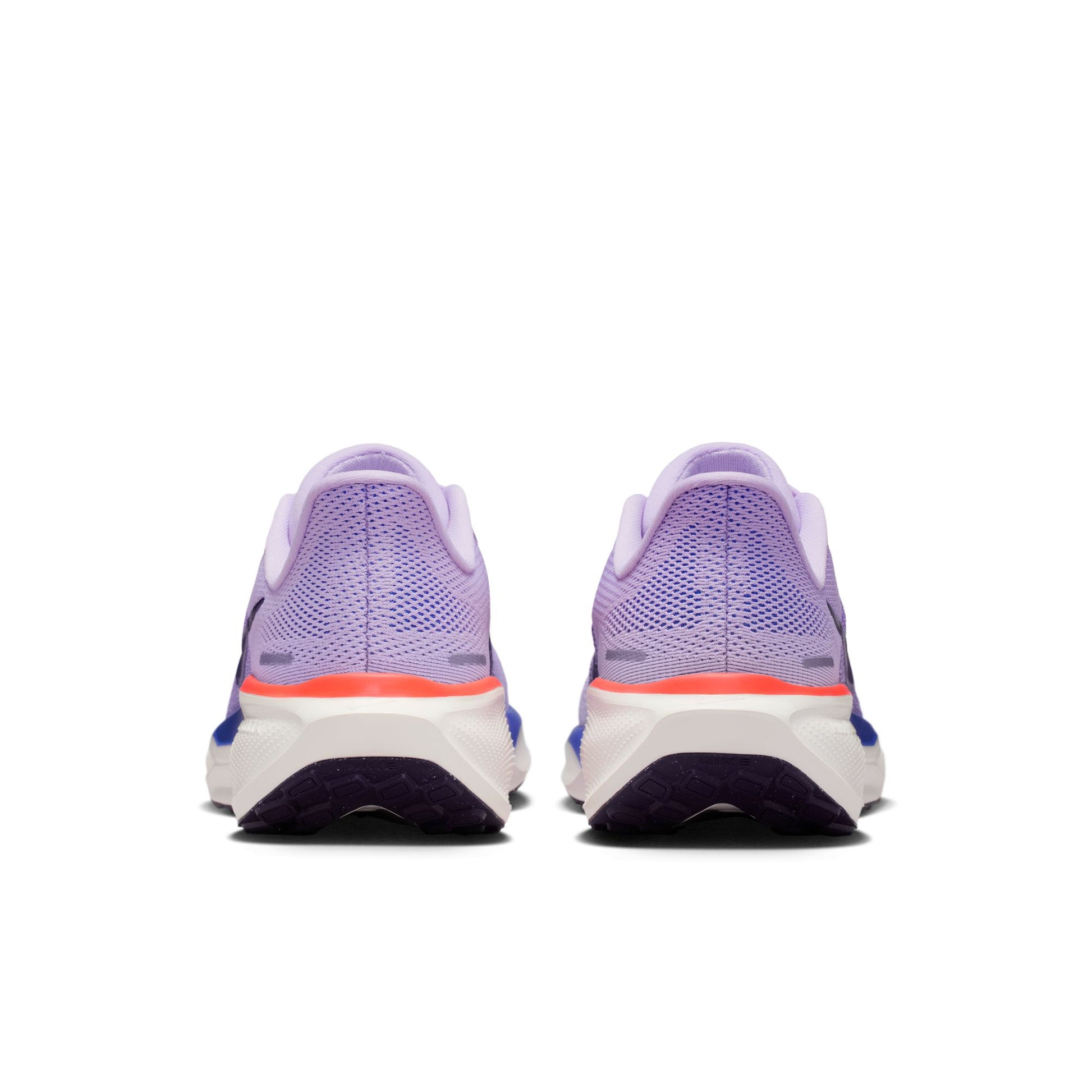 Purple running shoes with a white sole on a white background