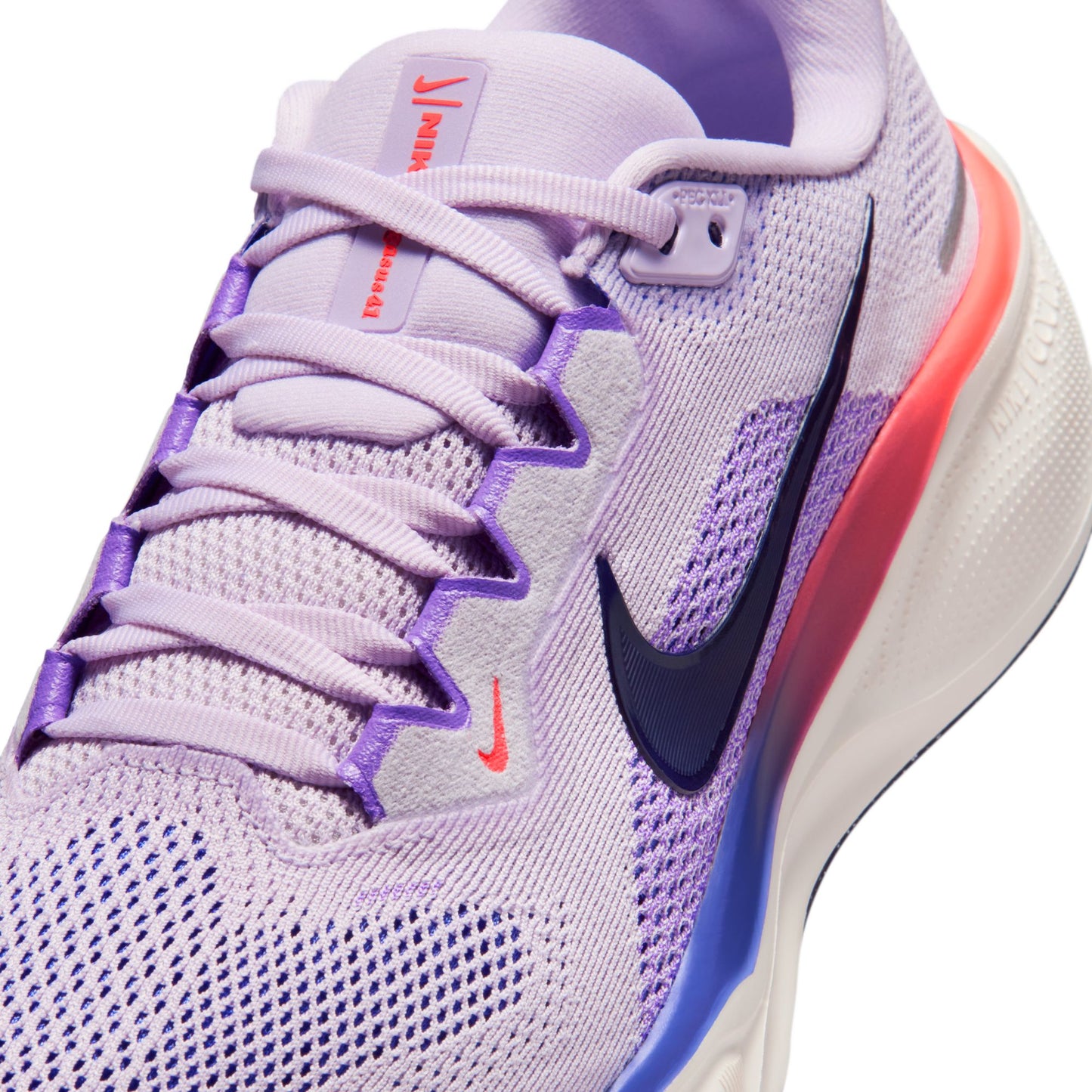 Purple and white sneaker with Nike logo on a white background