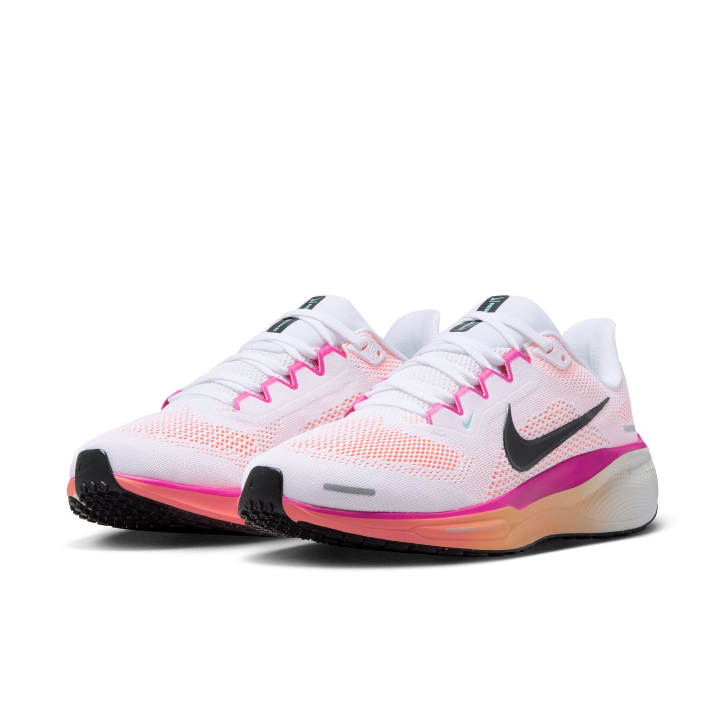 White running shoes with pink and black accents on a white background