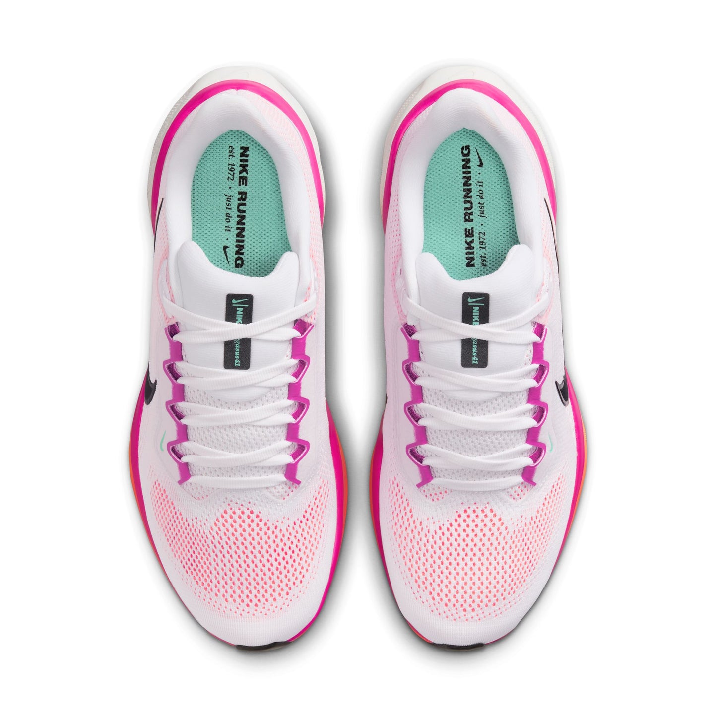 White and pink Nike running shoes on a white background