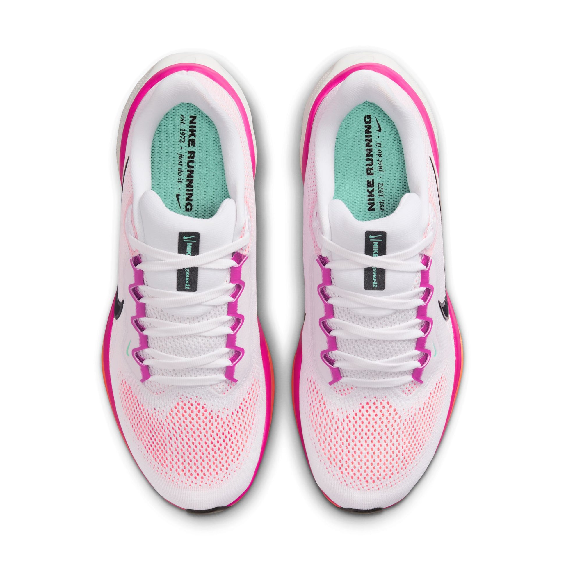 White and pink Nike running shoes on a white background