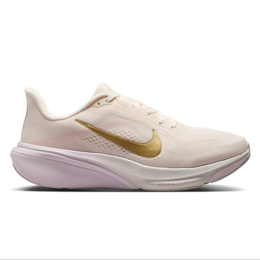 A Nike running shoe in a light cream/off-white colorway with a metallic gold Swoosh and a pale pinkish-lavender midsole, shown from the side on a white background.