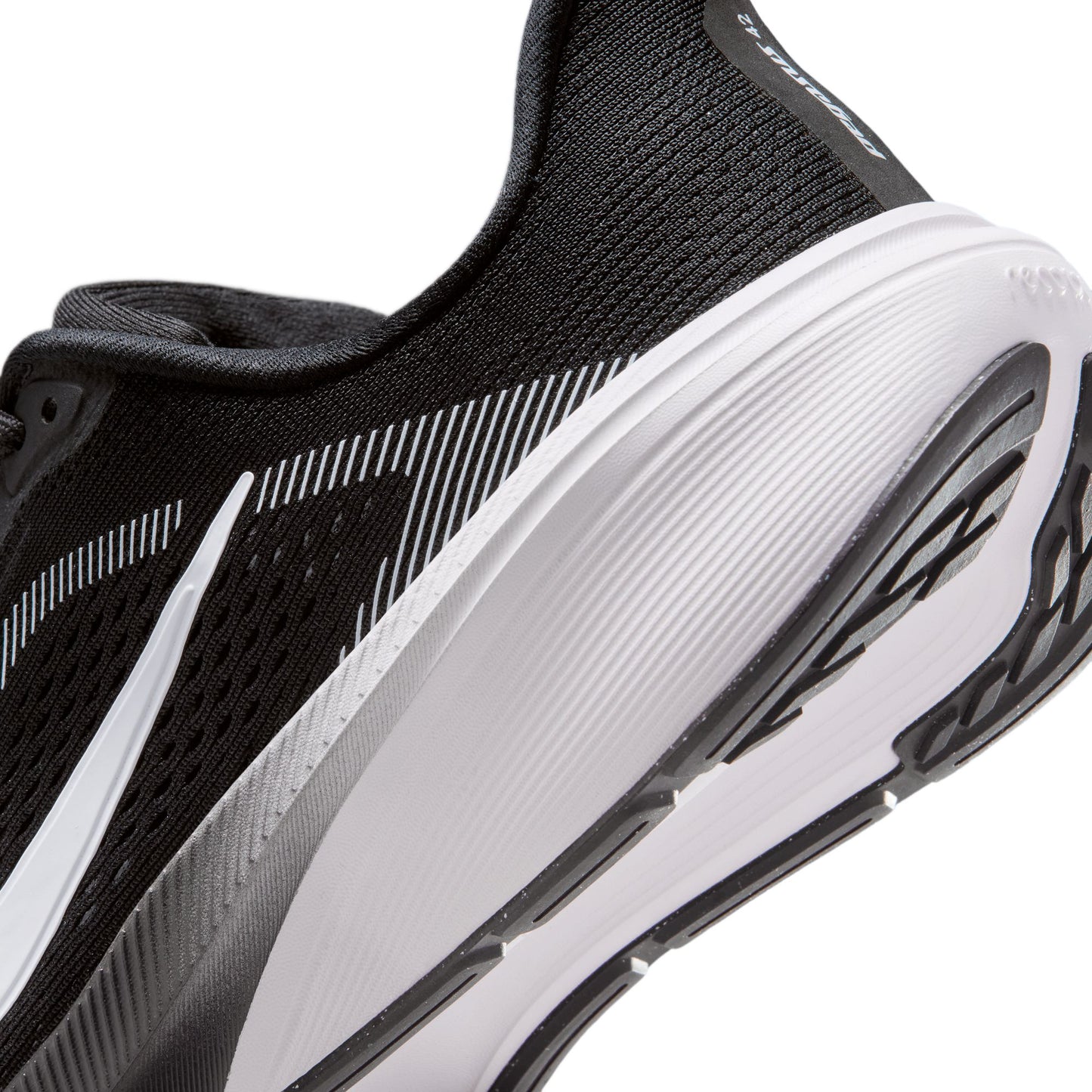 Black and white running shoe with visible brand logo on a white background