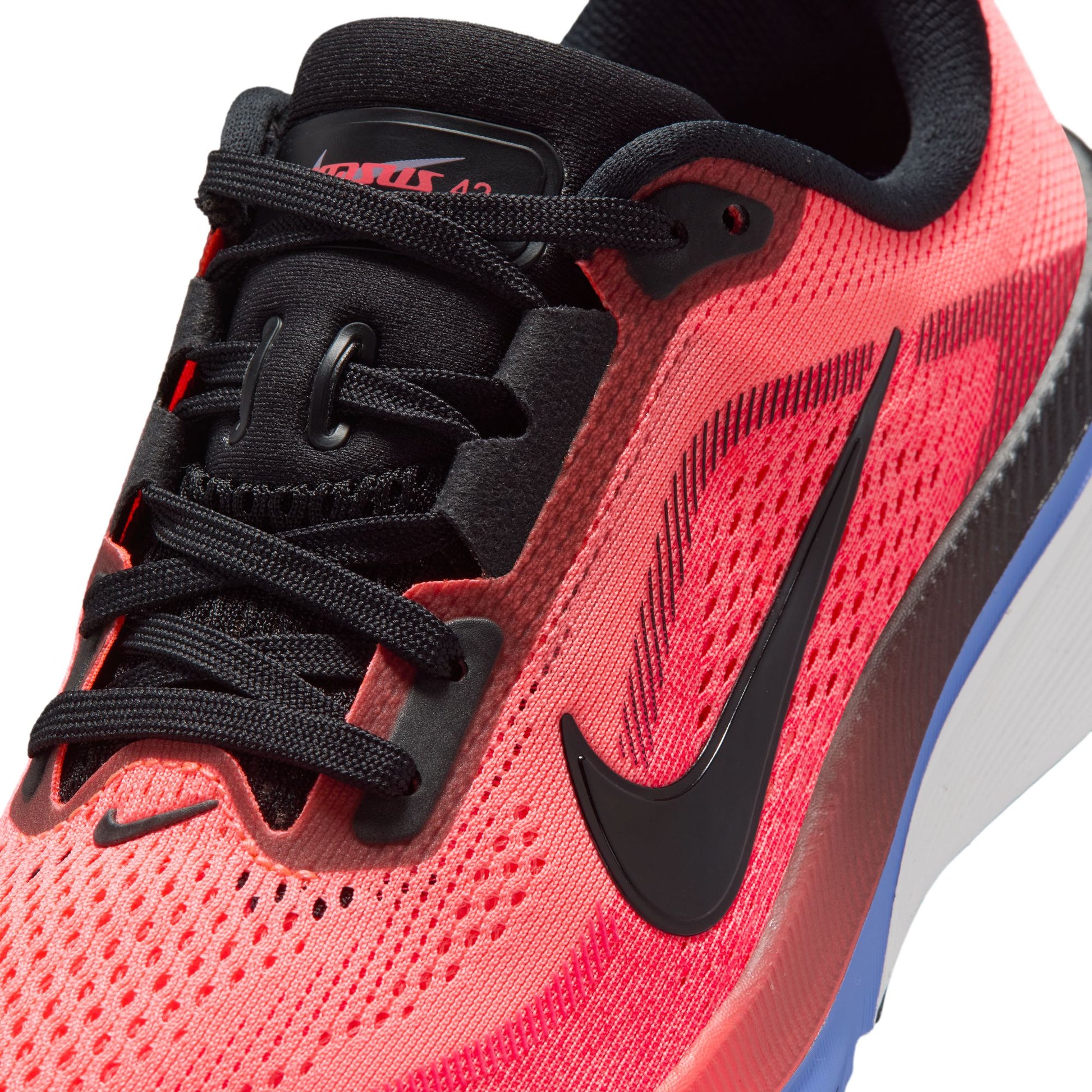 Red running shoe with black Nike logo on a white background