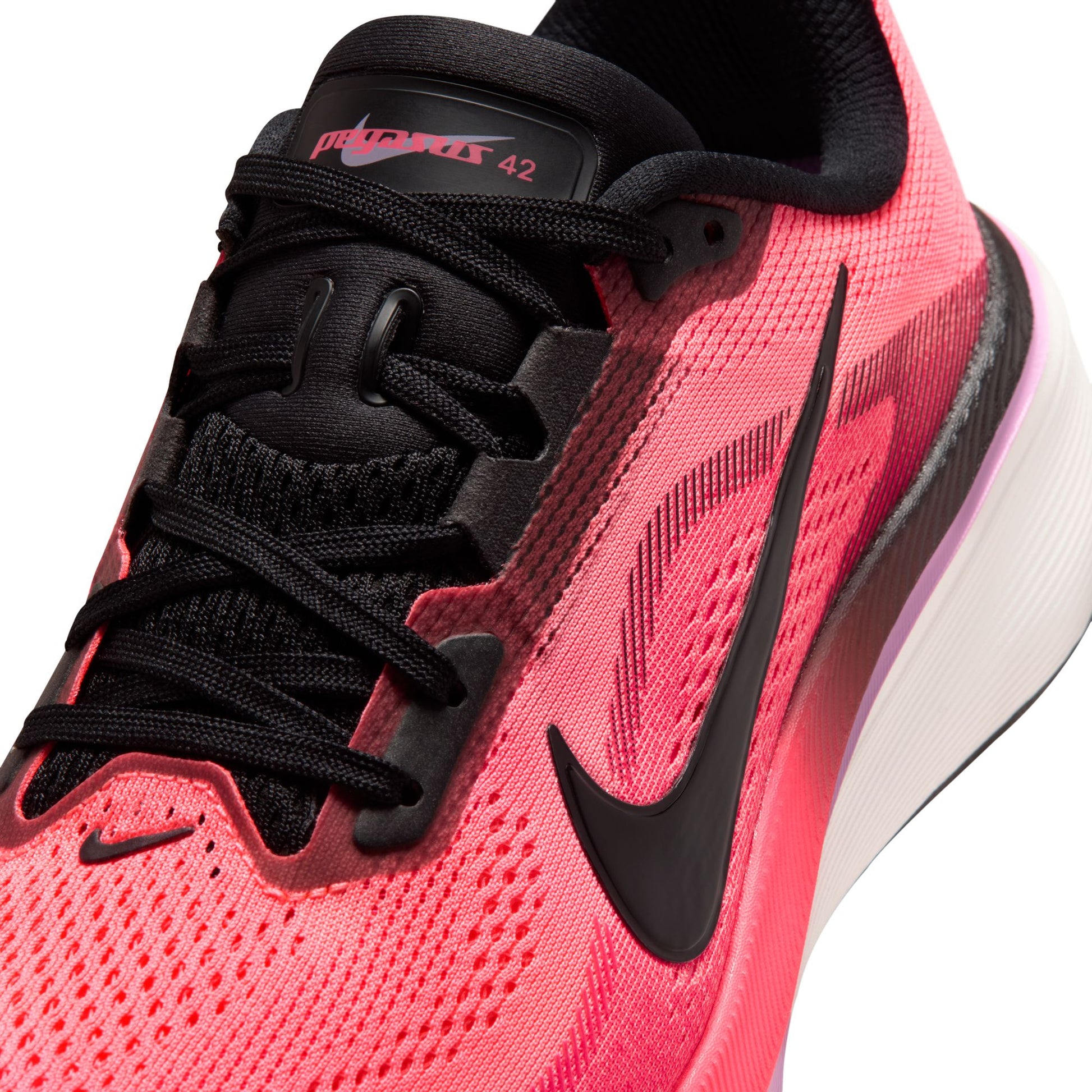 Pink running shoe with black laces and Nike logo on a white background