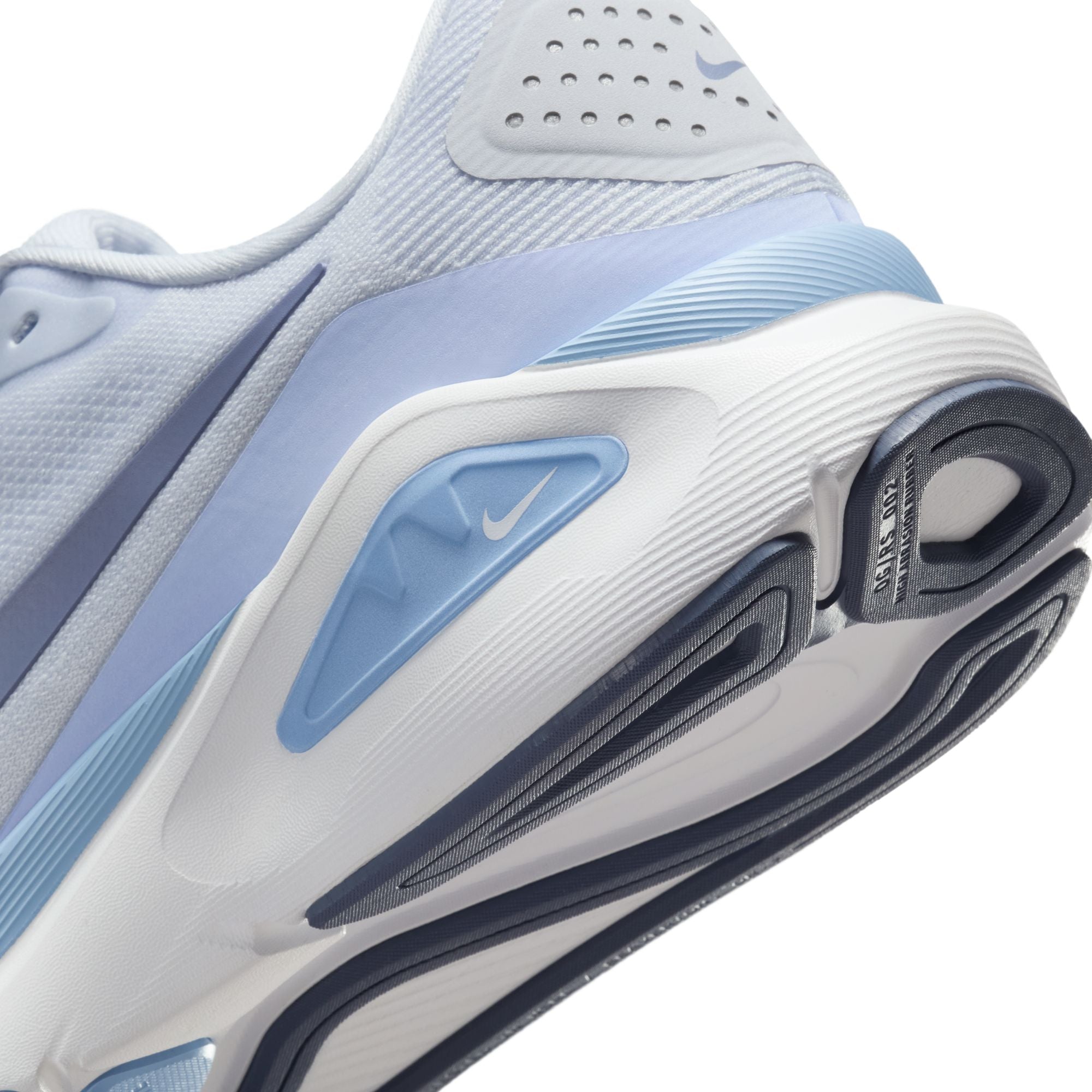 Close-up of a white and blue sneaker with Nike logo on a white background