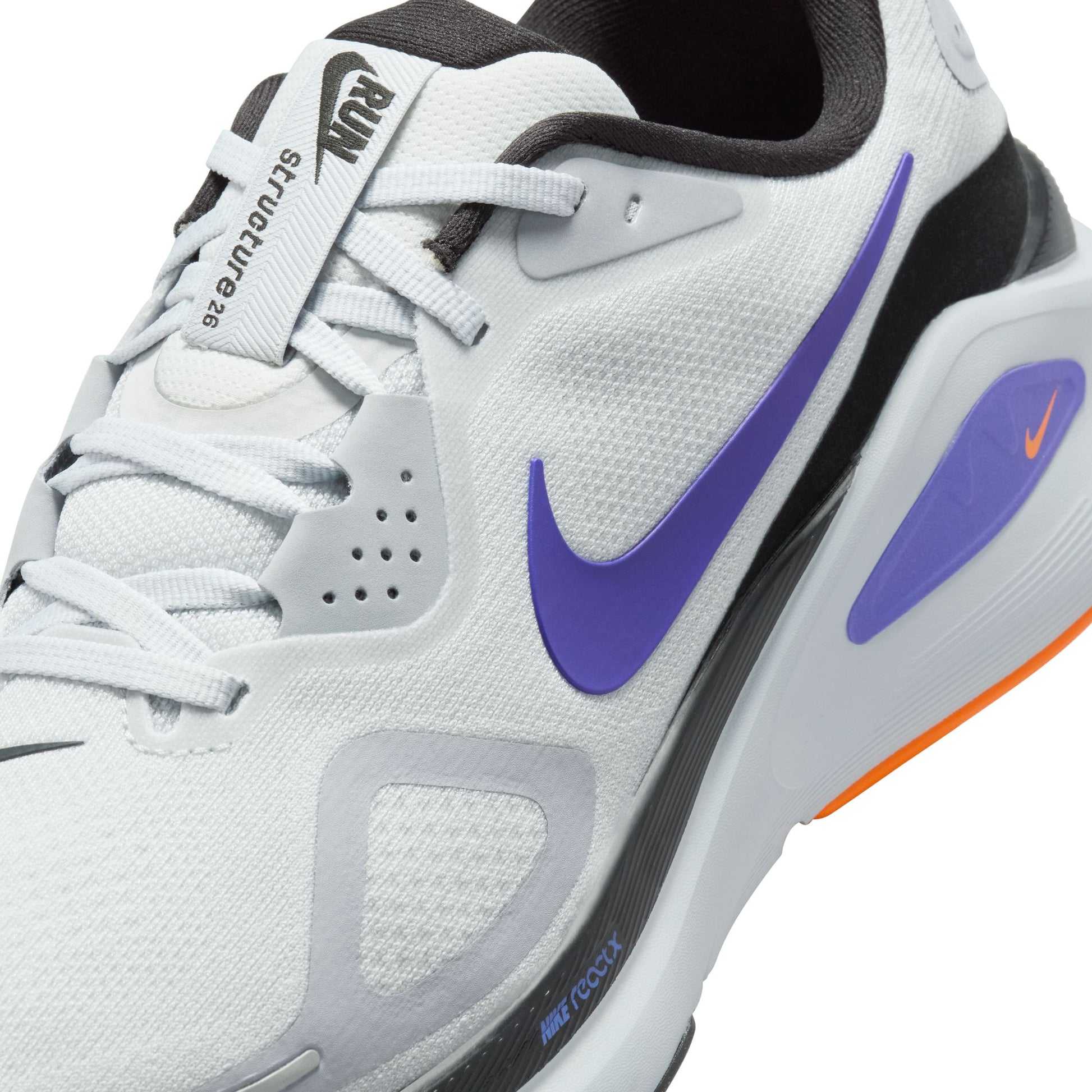 White Nike running shoe with purple swoosh logo on a white background