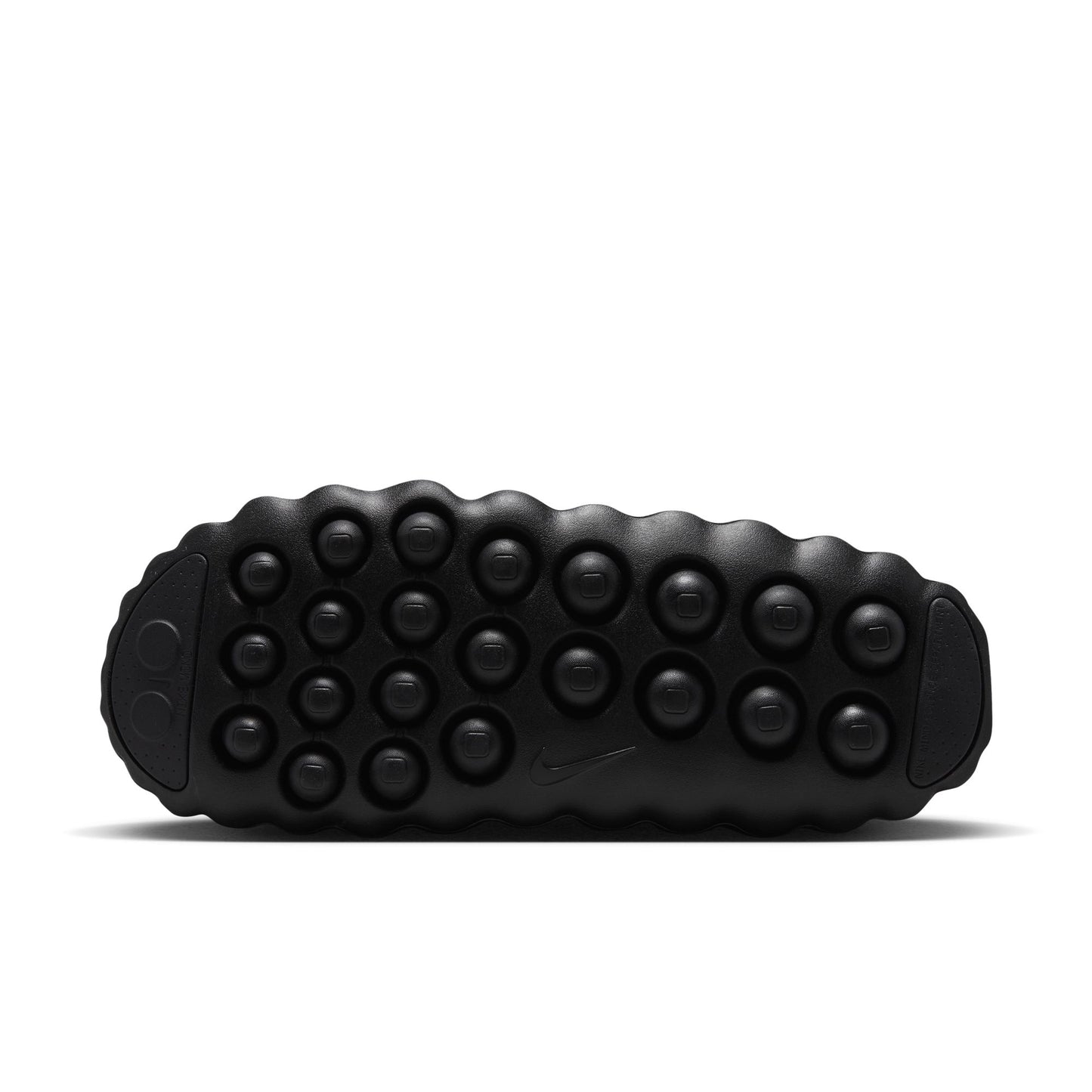 Black sole of a shoe with textured pattern on a white background