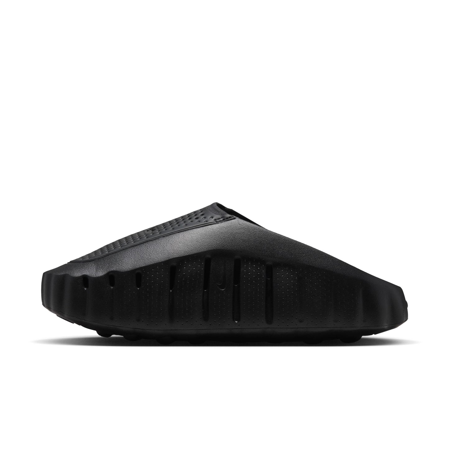 Black sandal with a textured sole on a white background