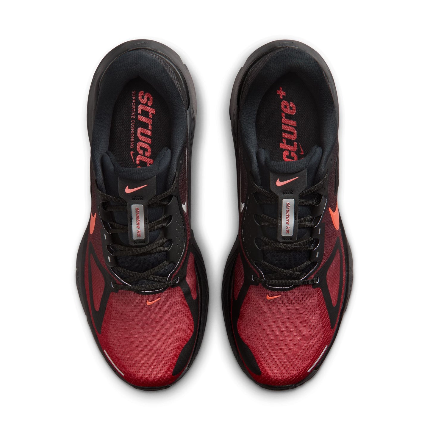 Red and black athletic shoes with visible Nike logo on a white background