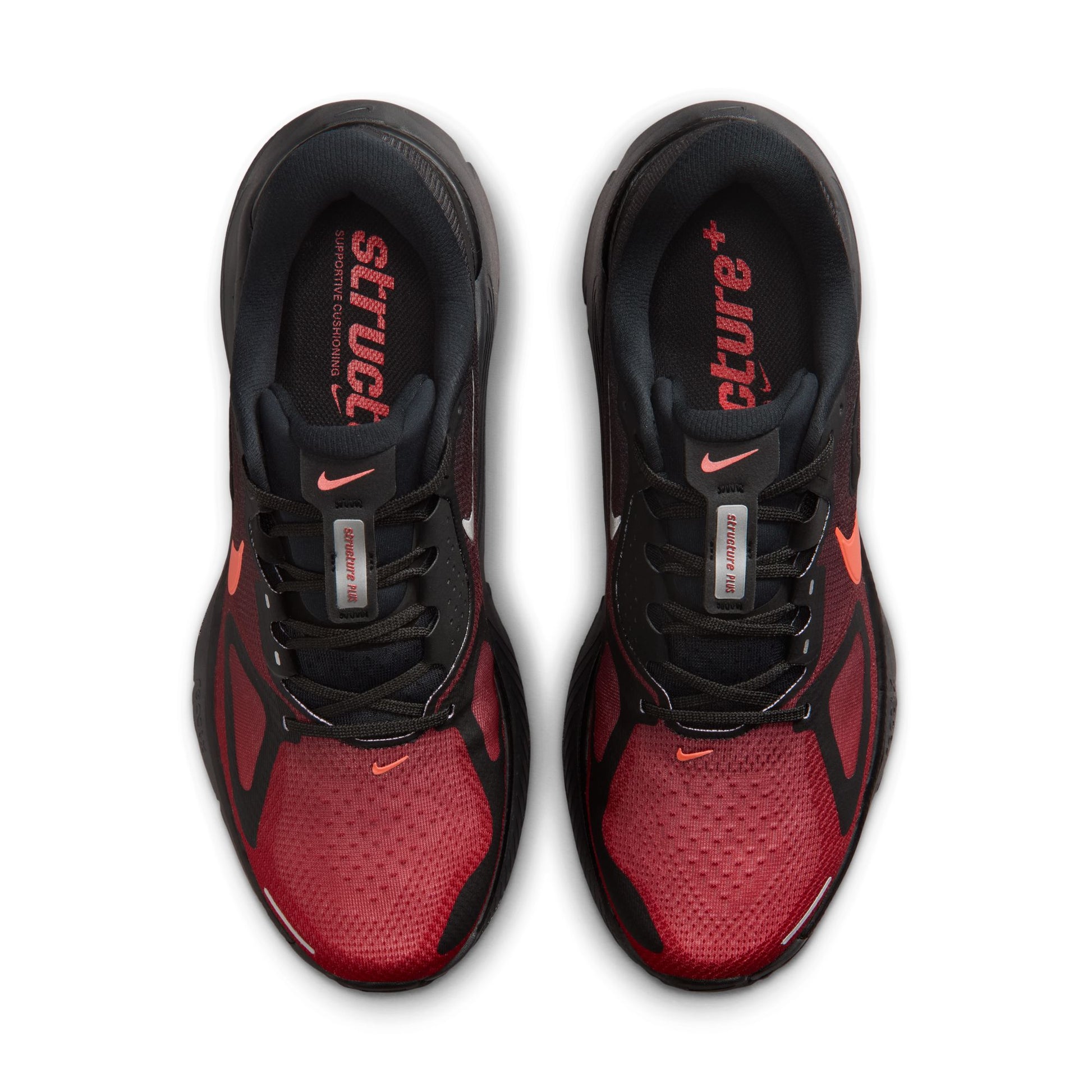 Red and black athletic shoes with visible Nike logo on a white background