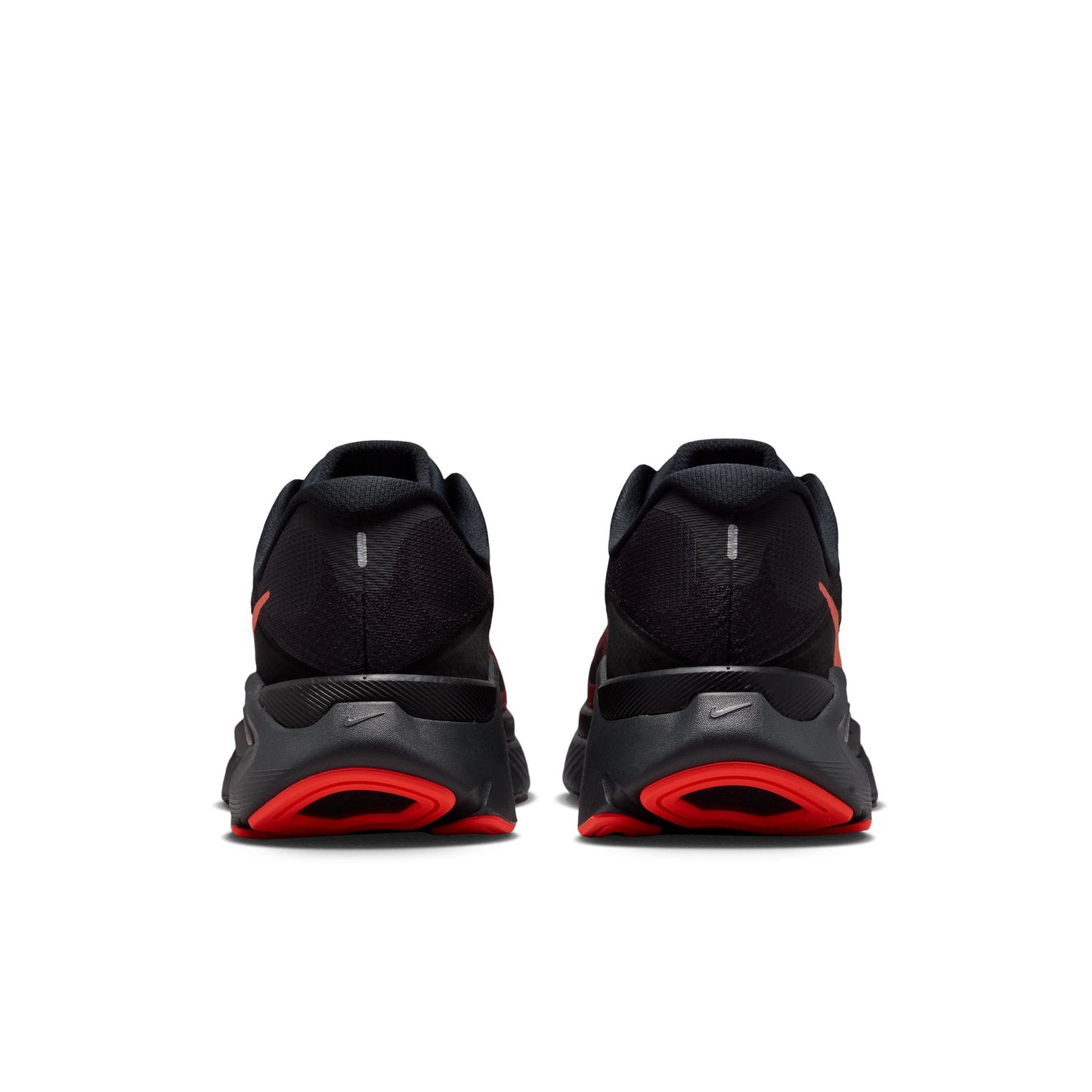 Black and red athletic shoes on a white background