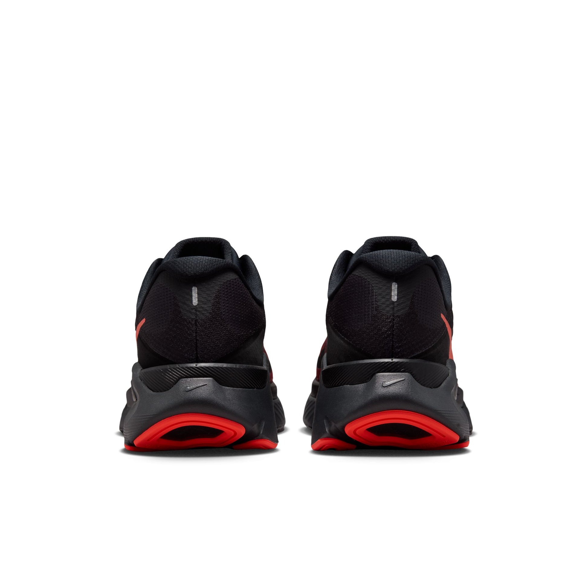 Black and red athletic shoes on a white background