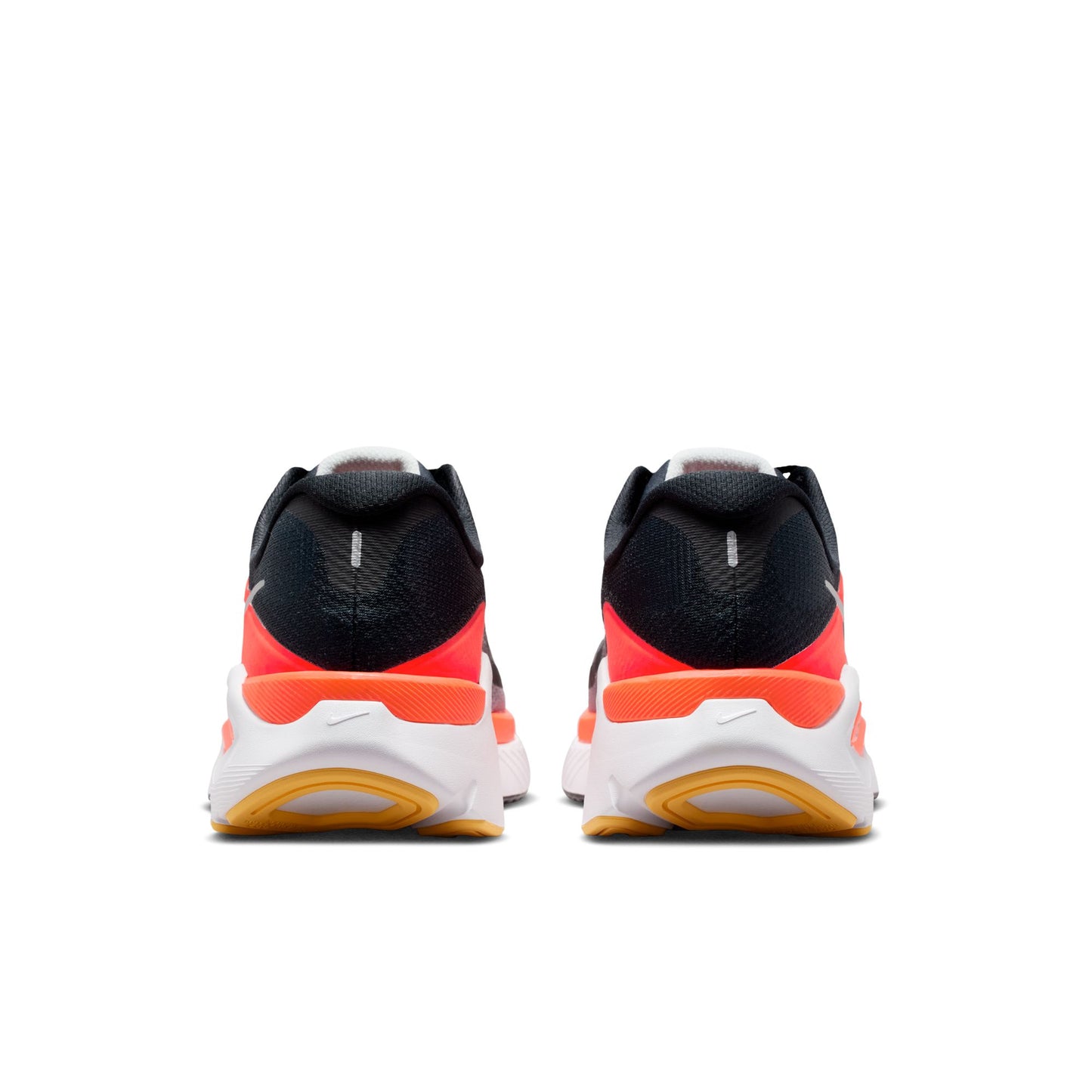 Black and orange athletic shoes on a white background