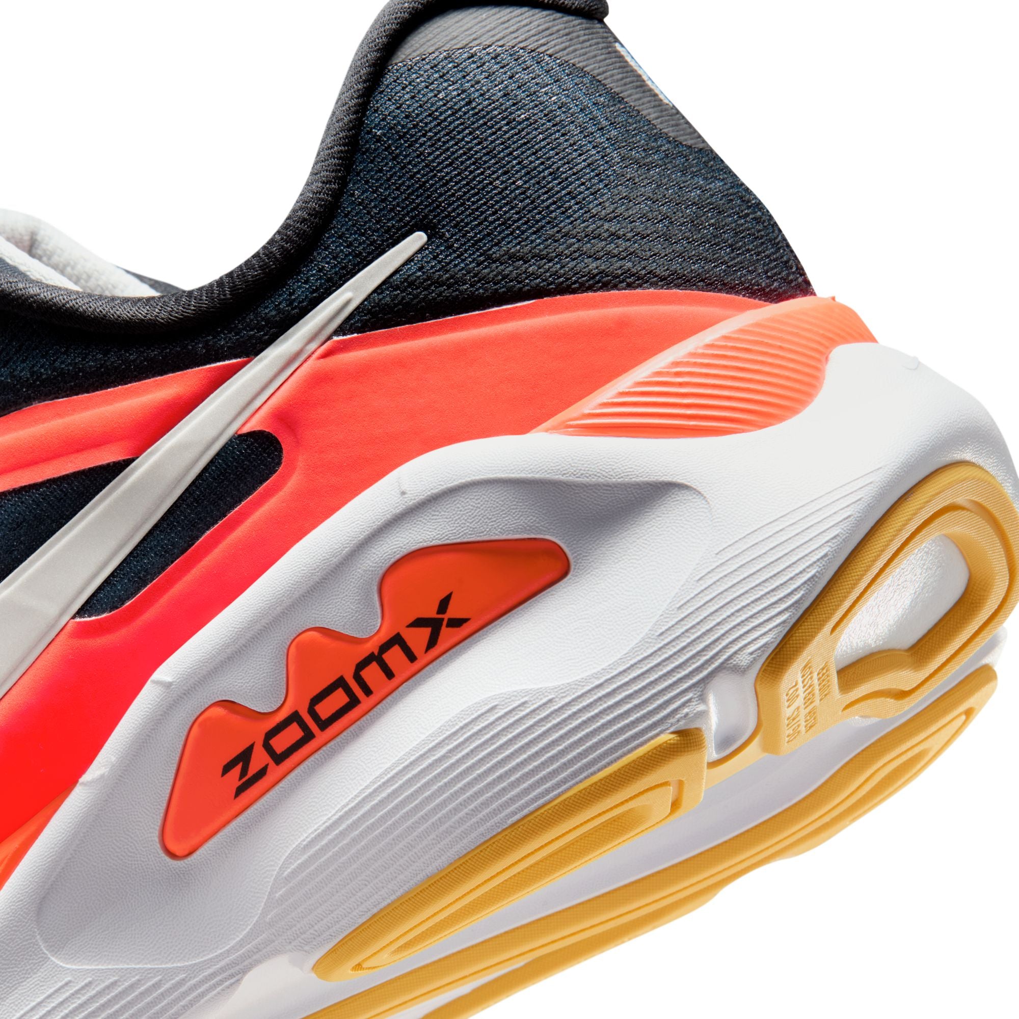 Close-up of a running shoe with 'ZoomX' branding on a white background