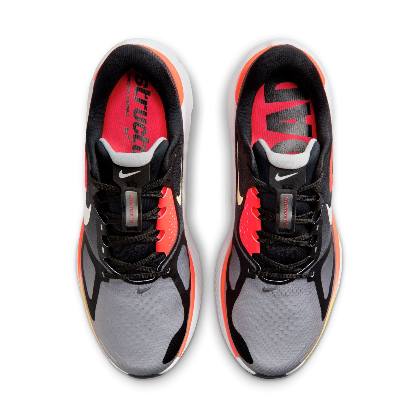 Pair of black, red, and gray athletic shoes on a white background