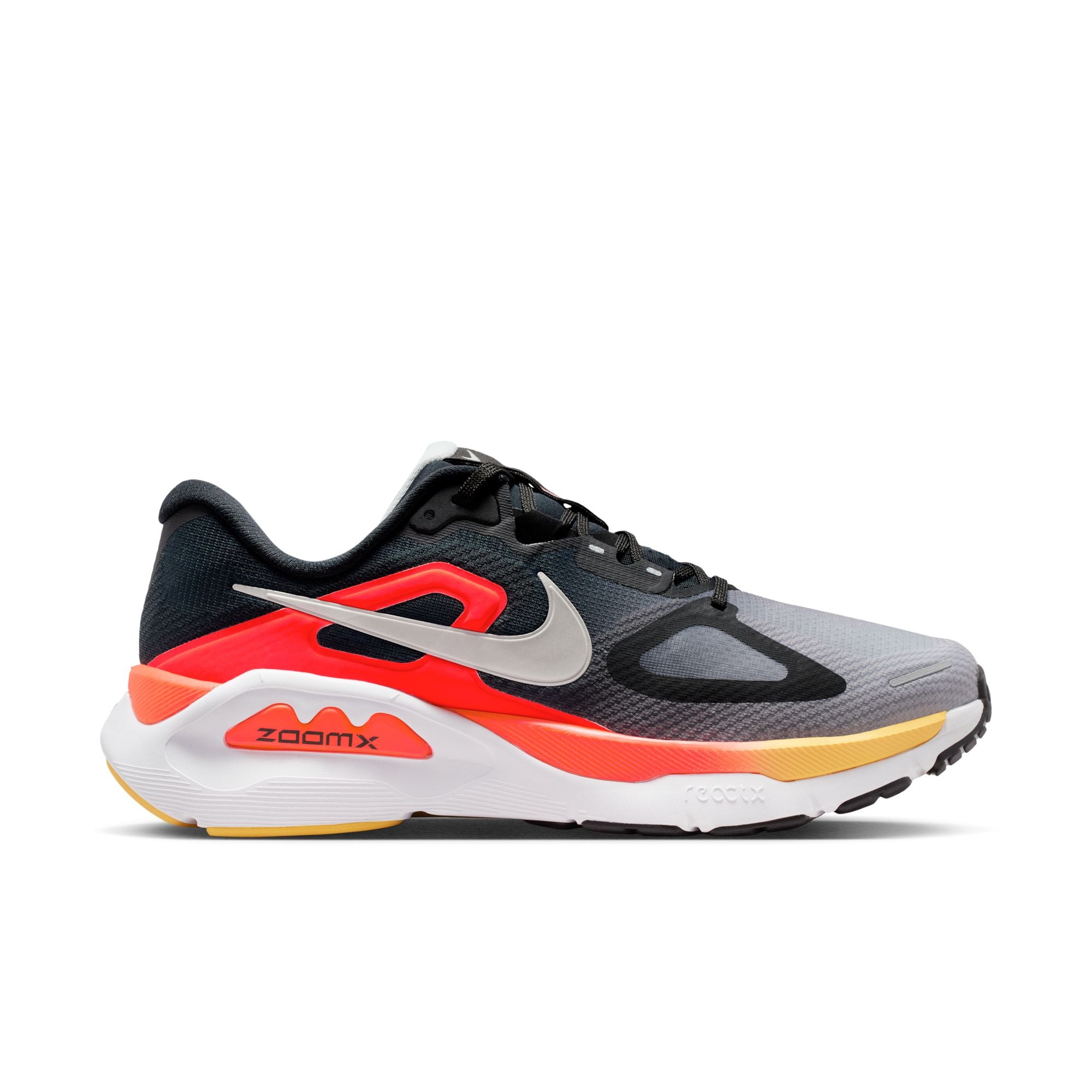 Black, red, and gray running shoe with Nike logo on a light gray background