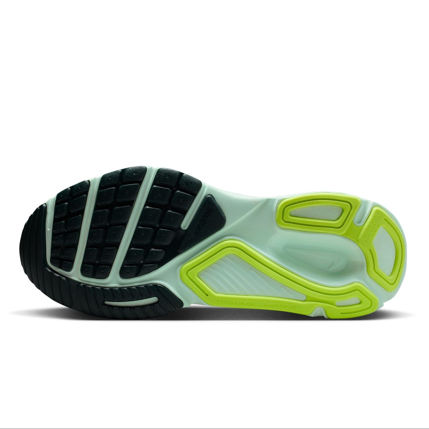 Close-up of a shoe sole with black, green, and white design on a white background