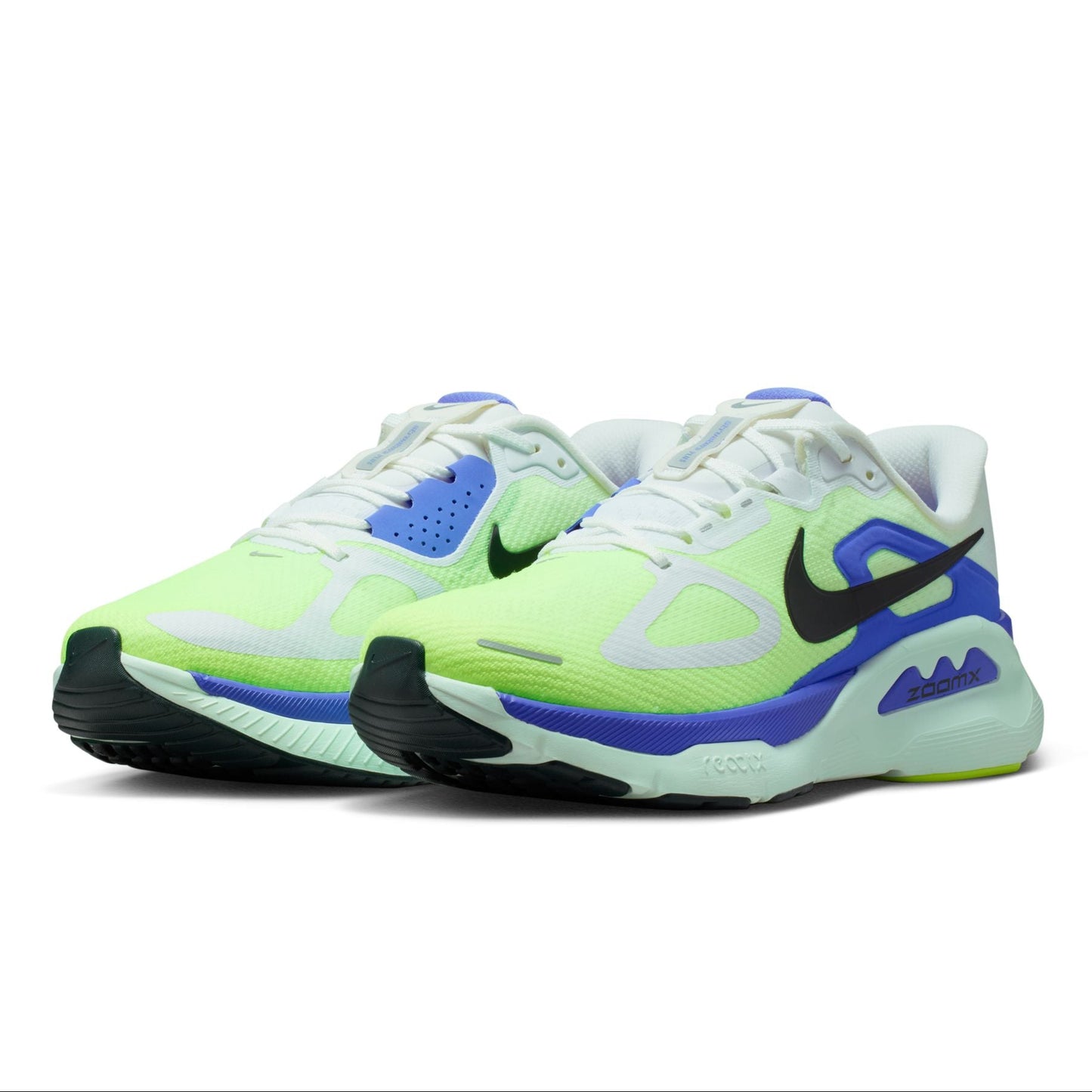 Pair of neon green and blue Nike sneakers on a white background