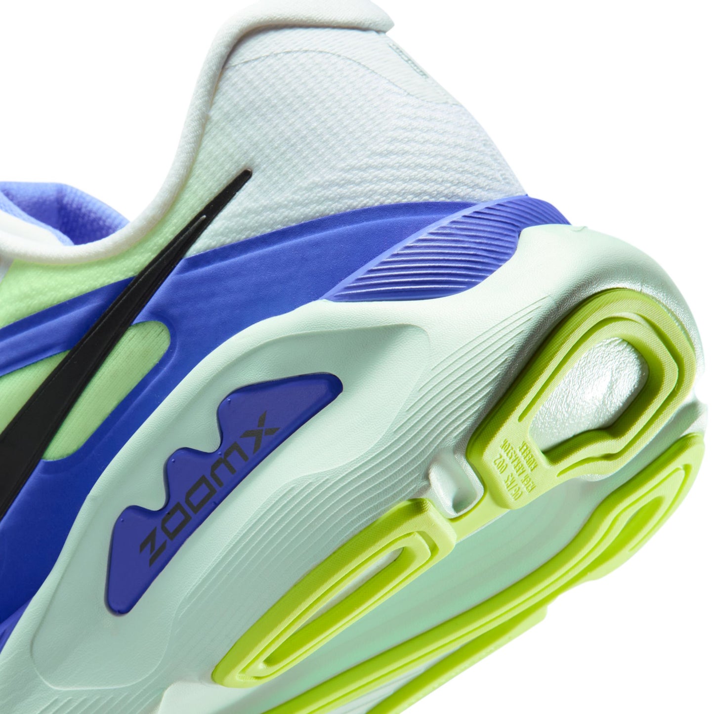 Close-up of a sneaker with blue, green, and white color scheme on a white background