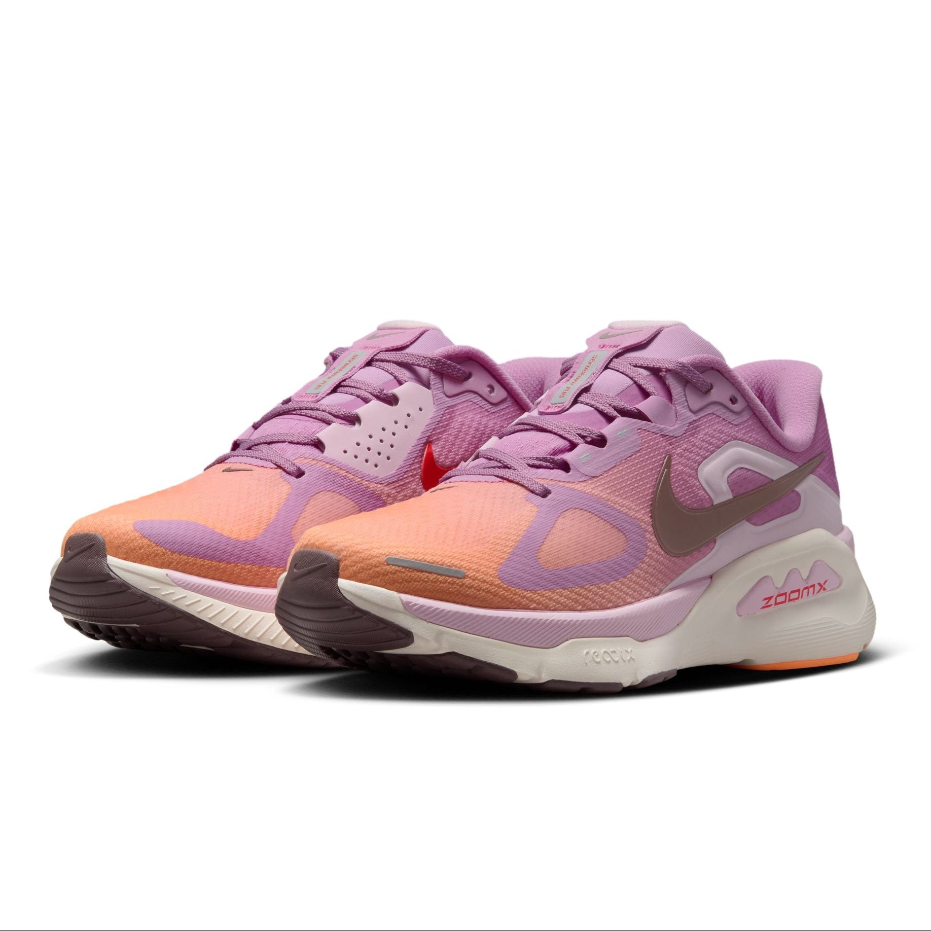 Pair of pink and orange running shoes on a white background