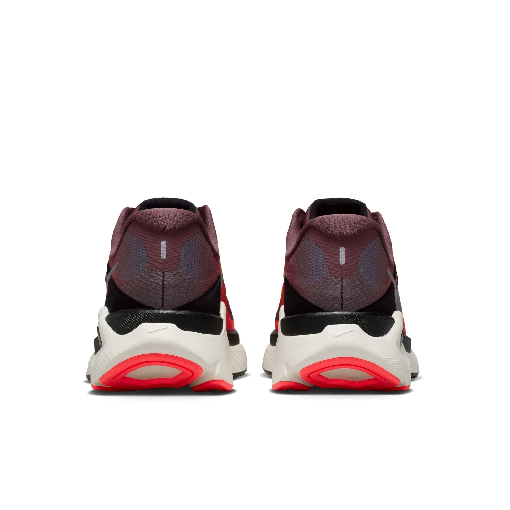 Pair of high-top sneakers with red accents on a white background