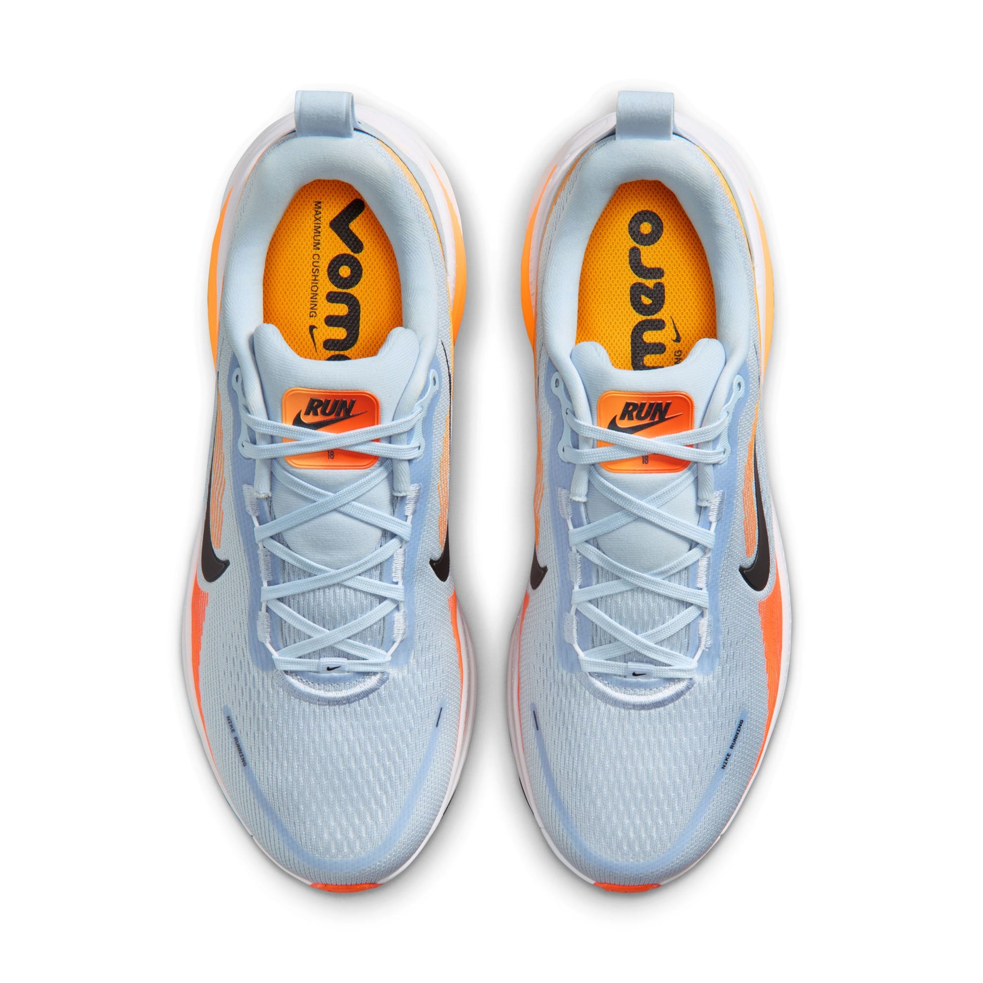 Light blue running shoes with orange accents on a white background