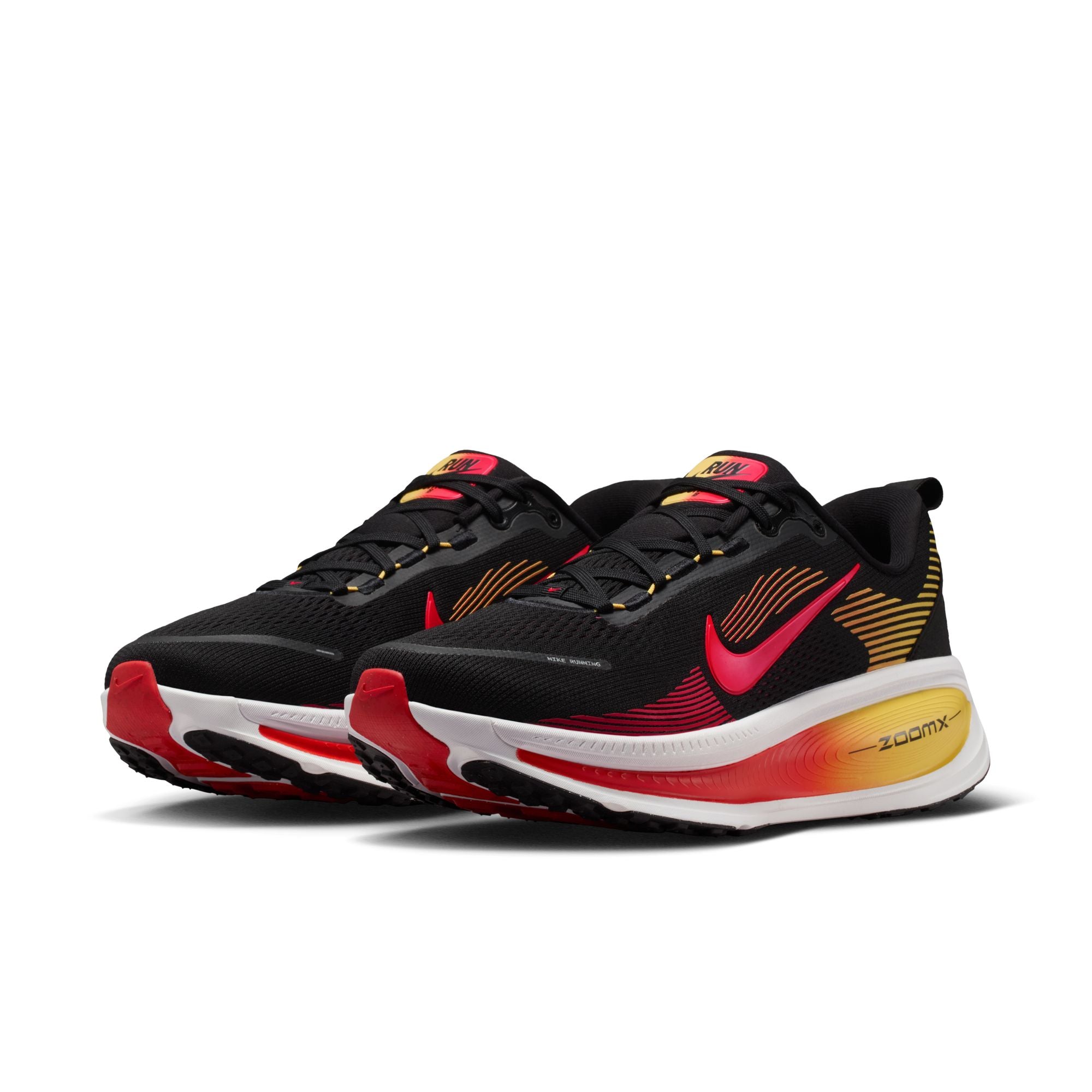 Black, red, and yellow running shoes with a prominent Nike logo on a white background