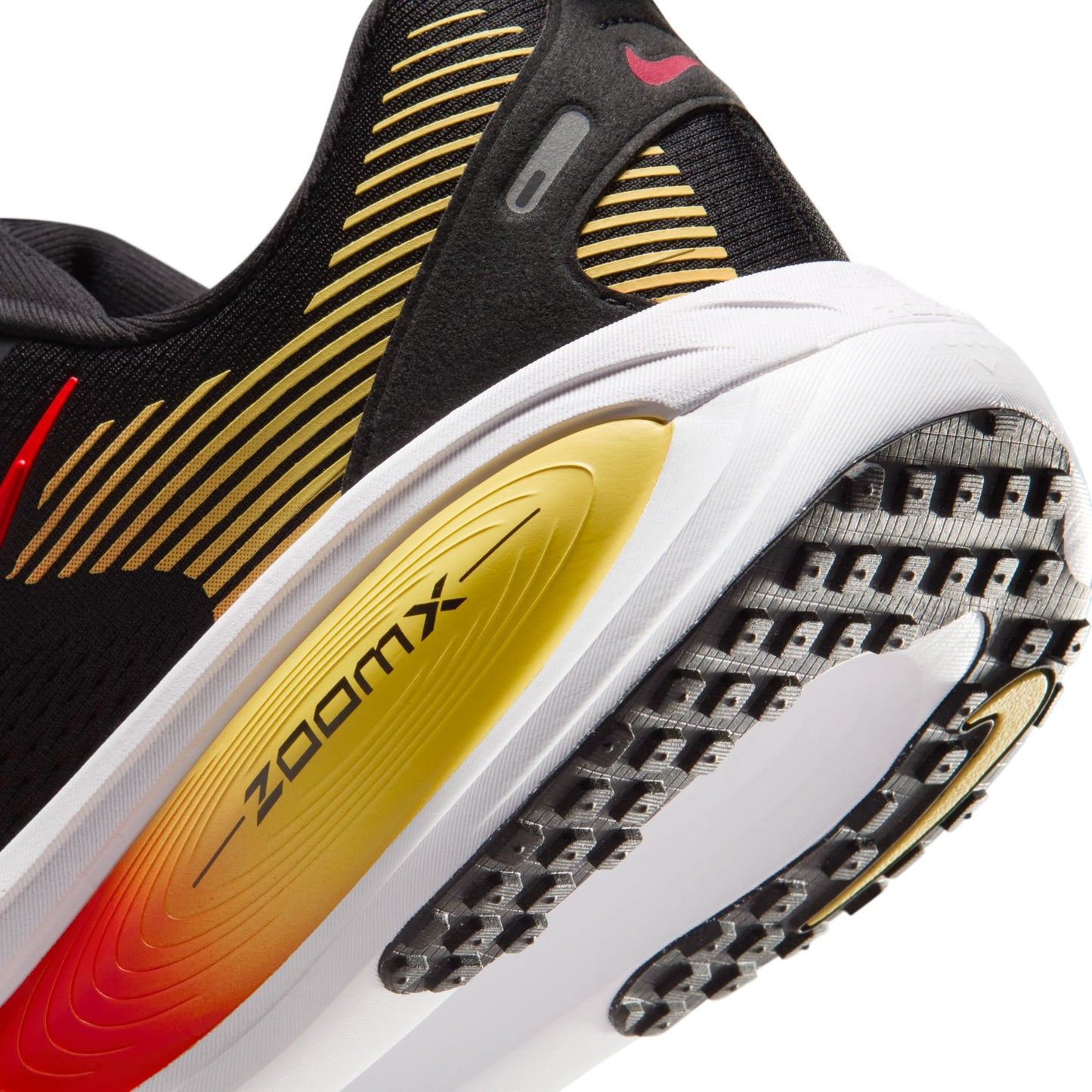 Close-up of a running shoe with 'ZoomX' technology on a white background