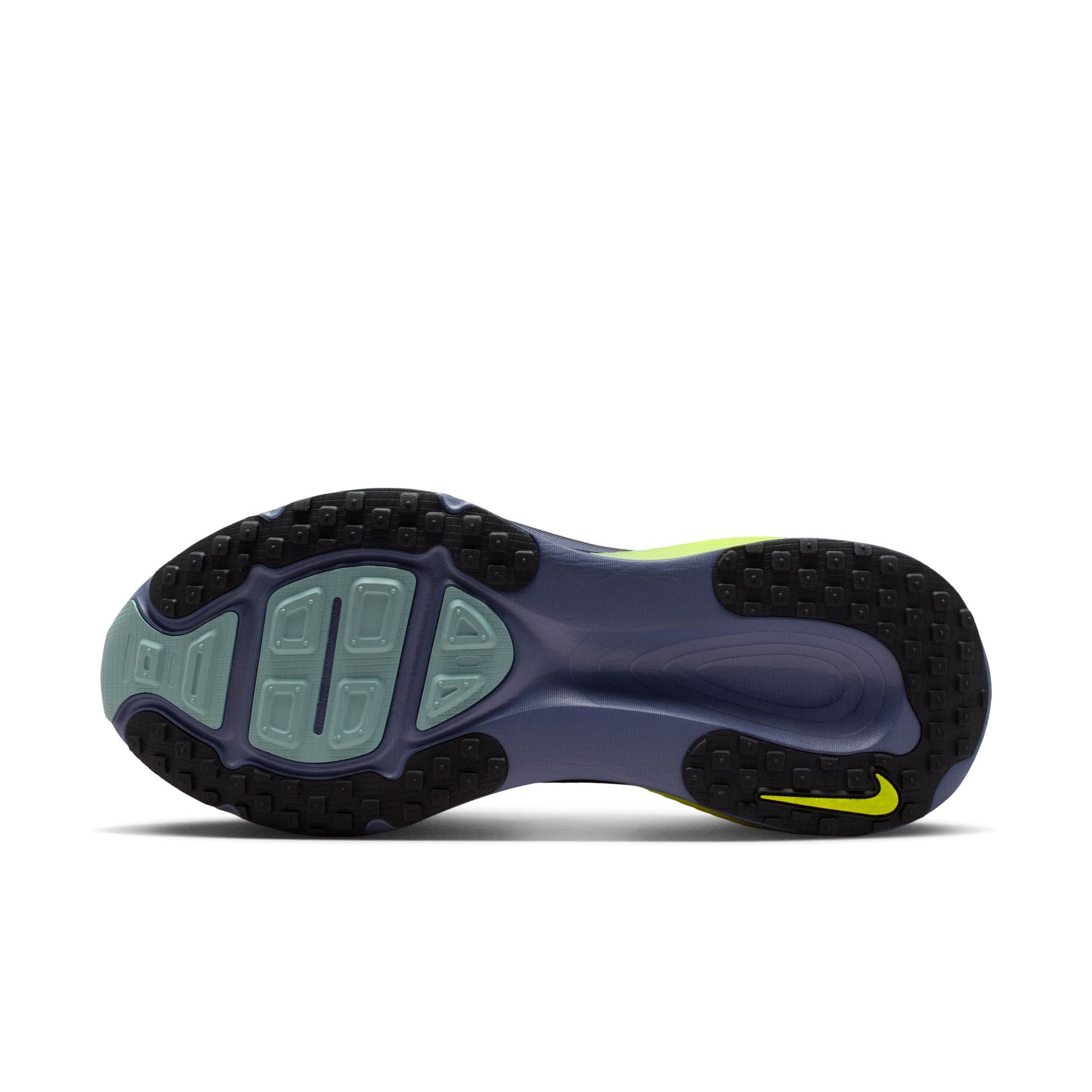 Side view of a sports shoe with a visible brand logo on a white background