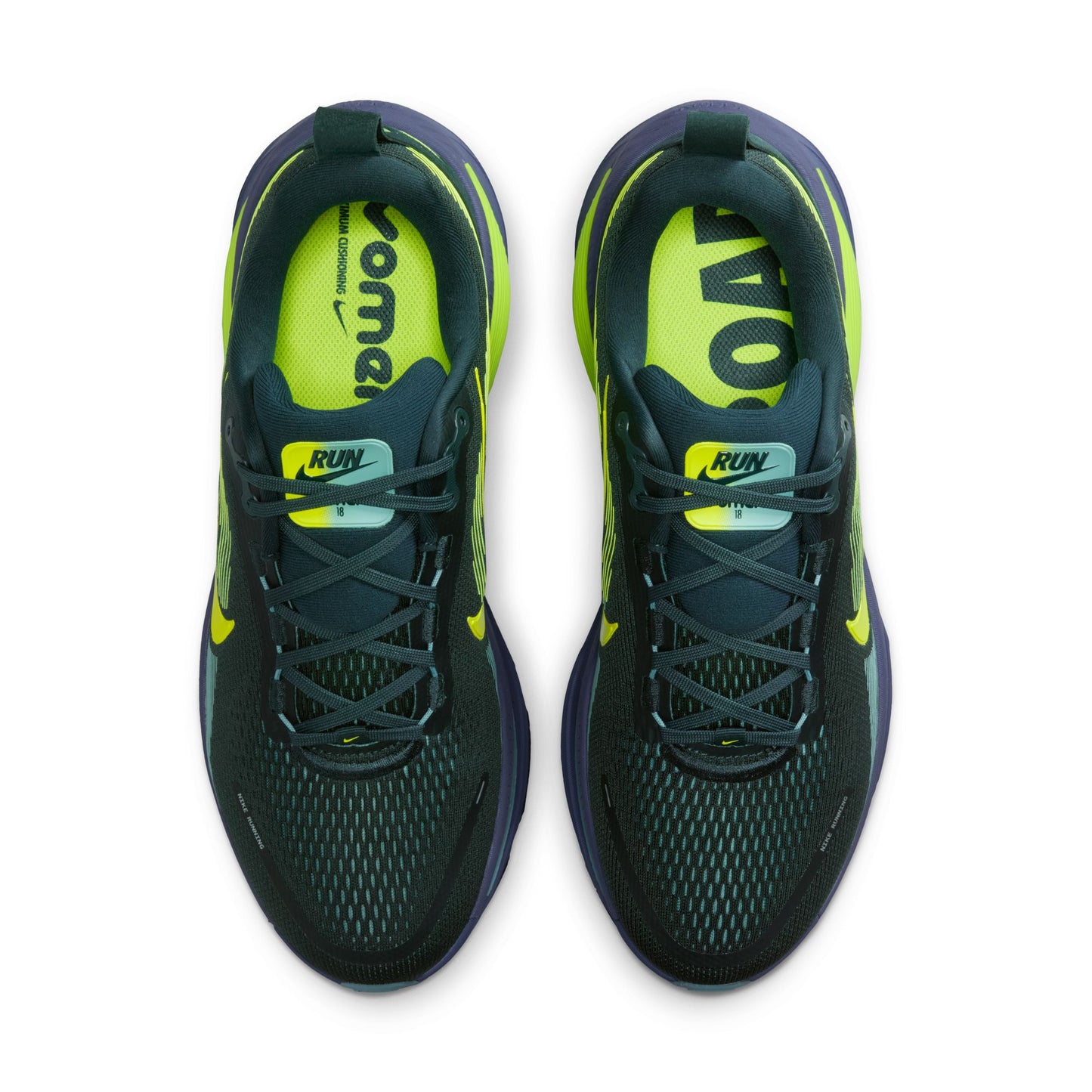 Pair of black and green running shoes on a white background