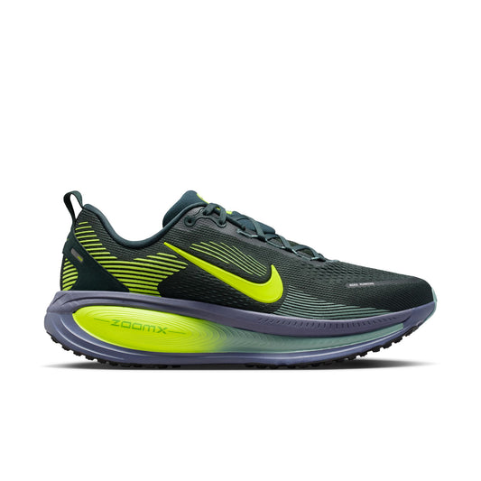 Black and green running shoe with Nike logo on a white background