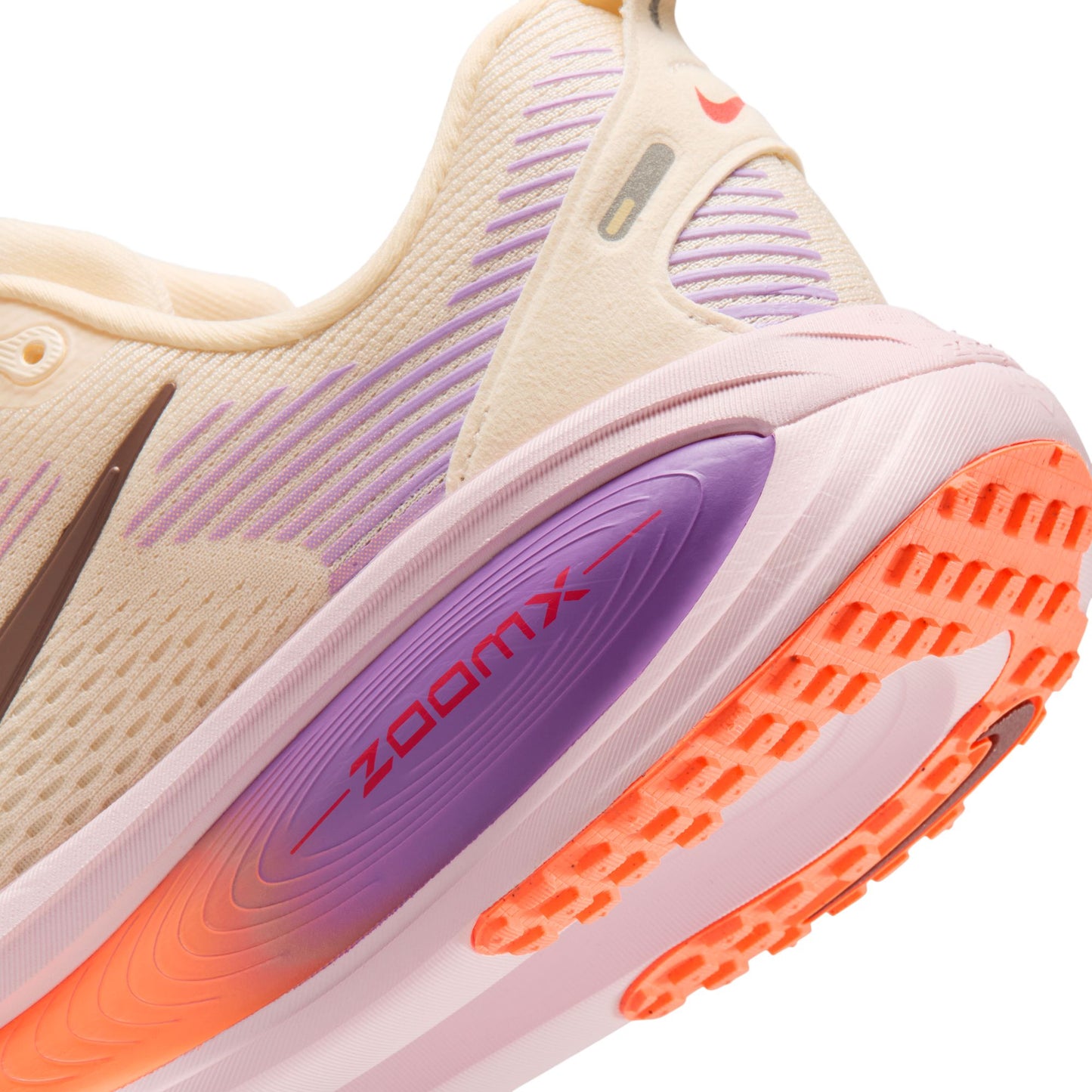 Close-up of a running shoe with 'zoom x' technology on a white background