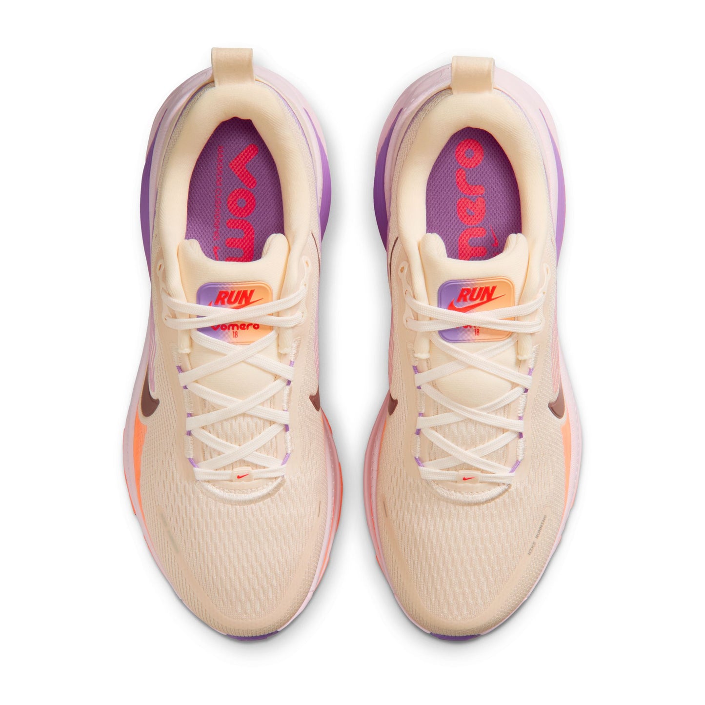 Beige running shoes with purple and orange accents on a white background