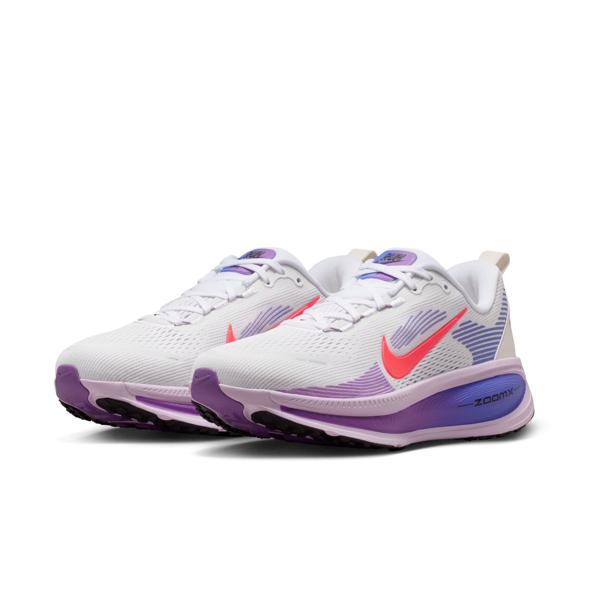 White running shoes with purple and pink accents on a white background