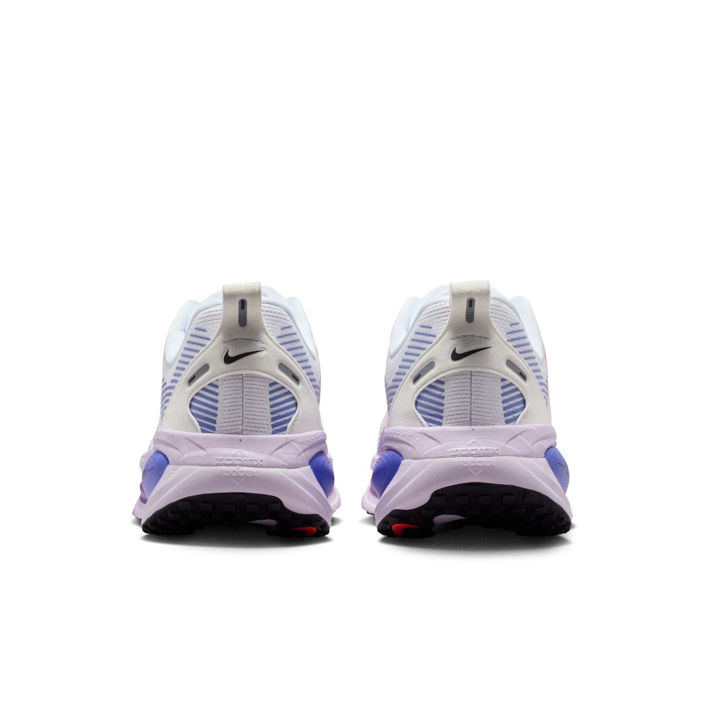 White and purple Nike sneakers on a white background