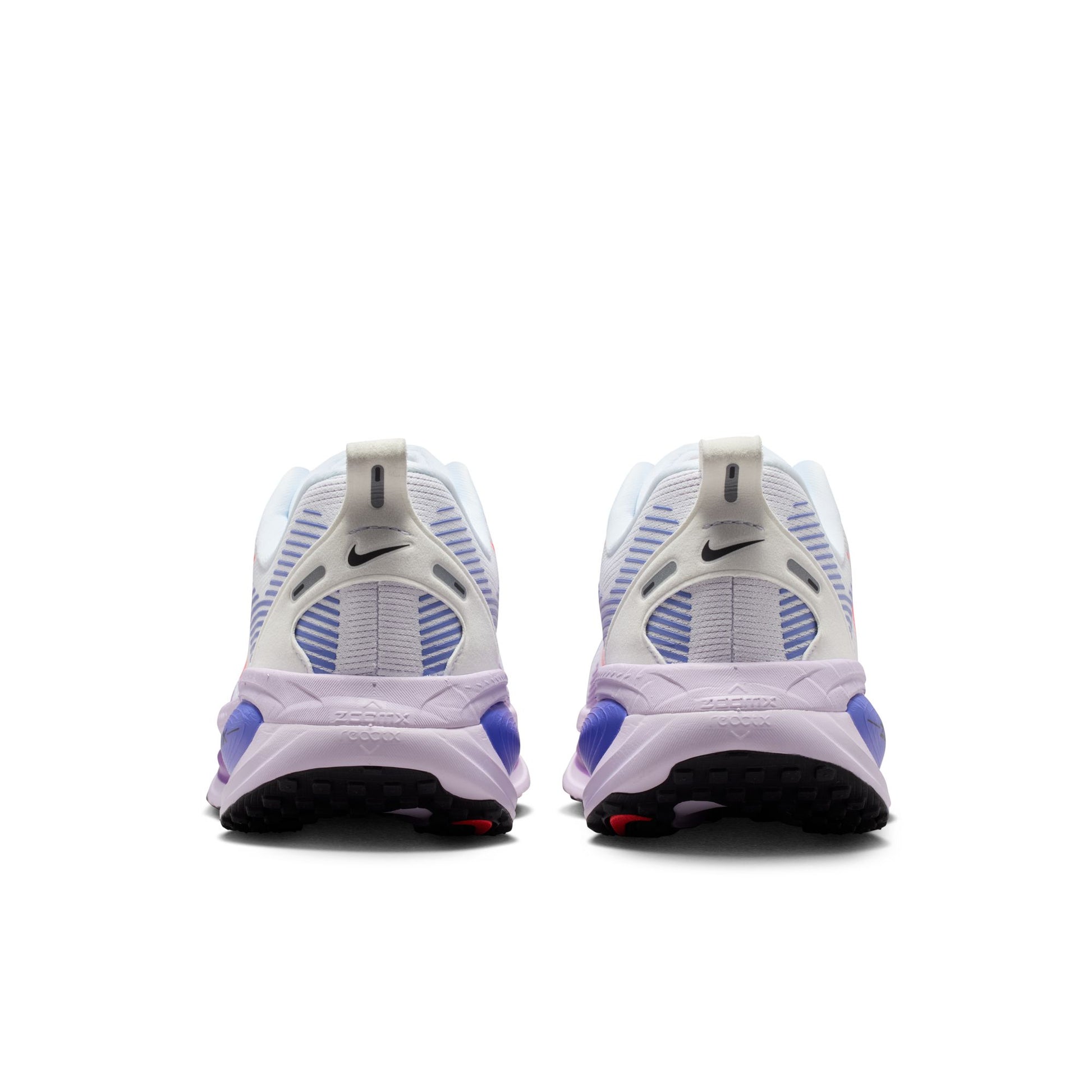 White and purple Nike sneakers on a white background