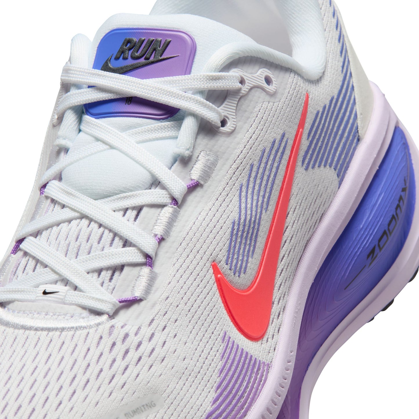 Gray running shoe with purple and red accents on a white background