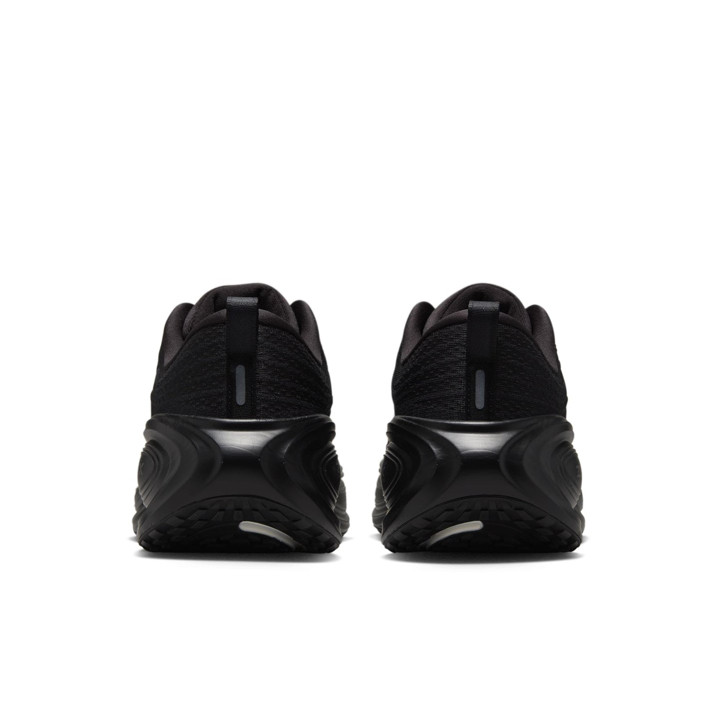 Black athletic shoes shown from the back on a white background