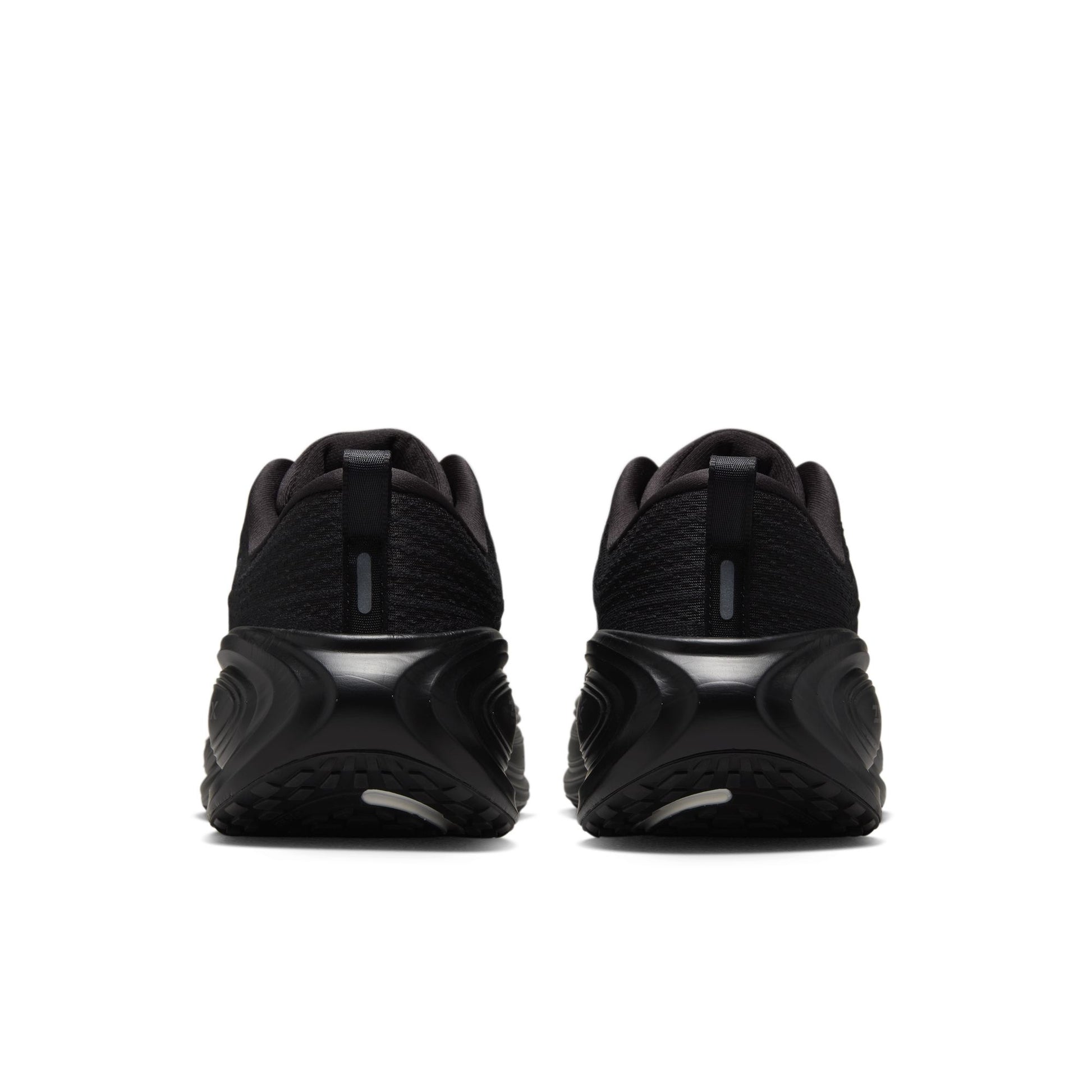 Black athletic shoes shown from the back on a white background