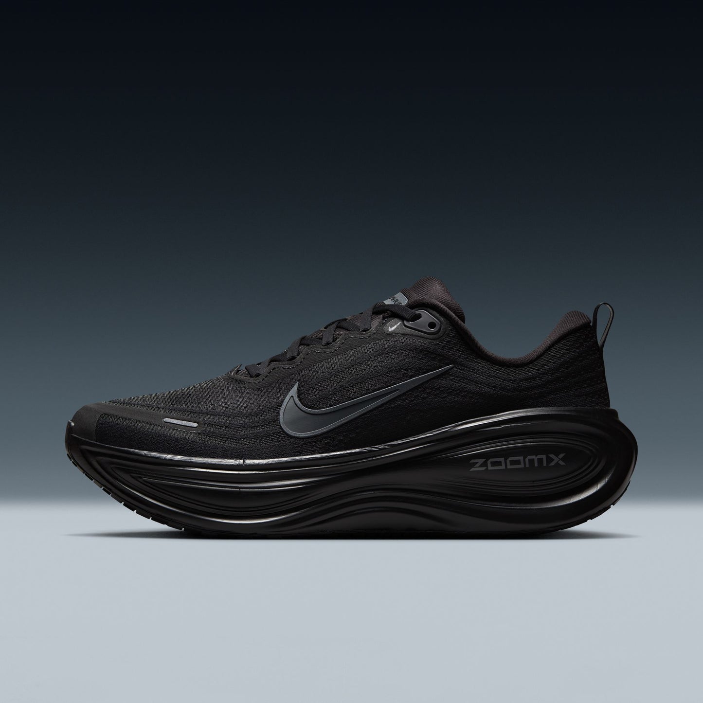 Black running shoe with Nike logo on a gradient background