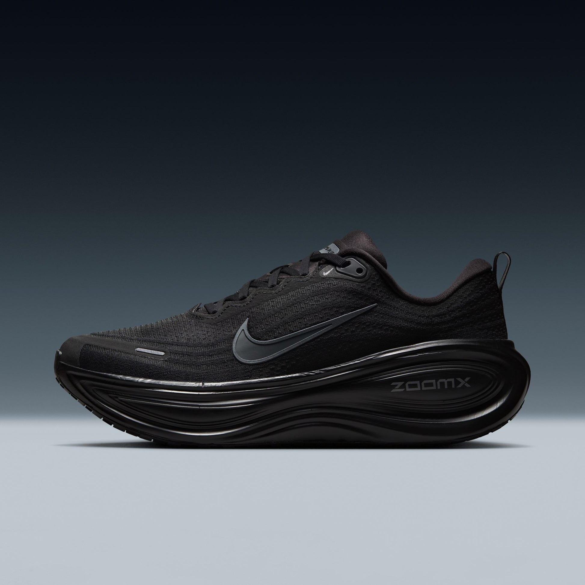 Black running shoe with Nike logo on a gradient background