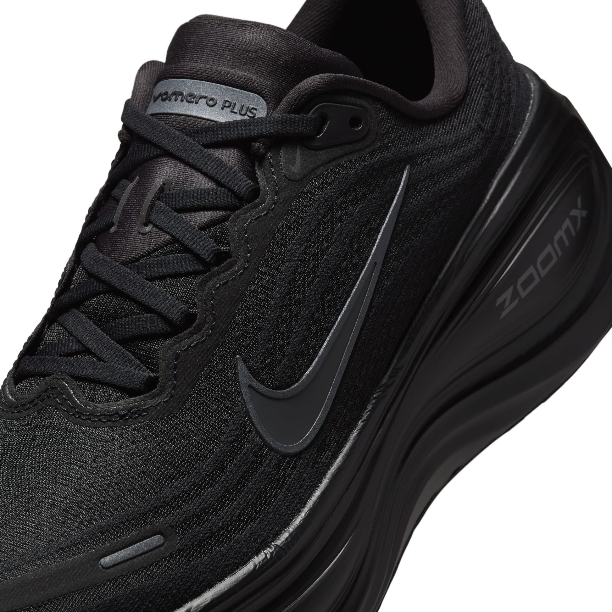 Black running shoe with Nike logo and 'Zoom' text on a white background